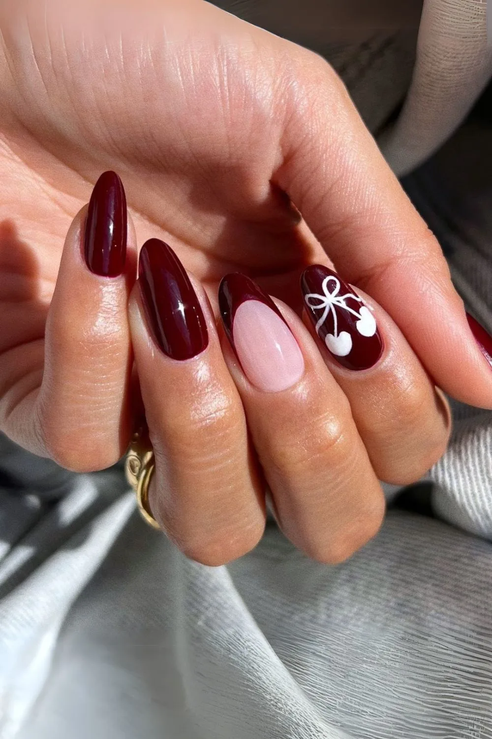 Dark burgundy nails with white cherry art