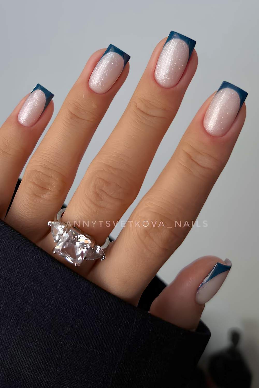 Dark green French mani on shimmery base