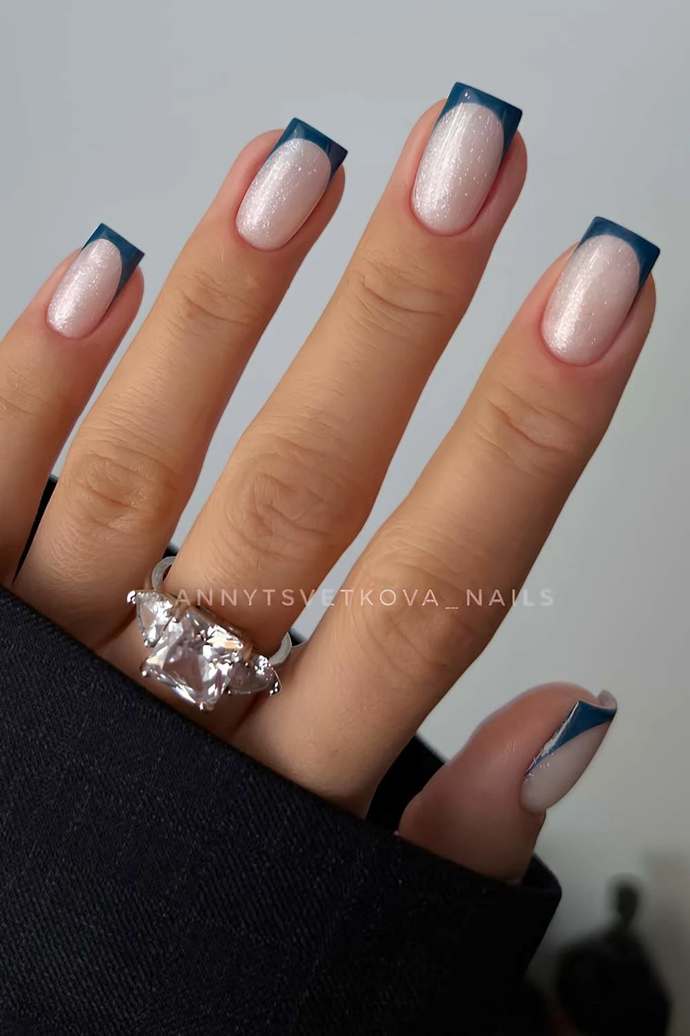 Dark green French mani on shimmery base