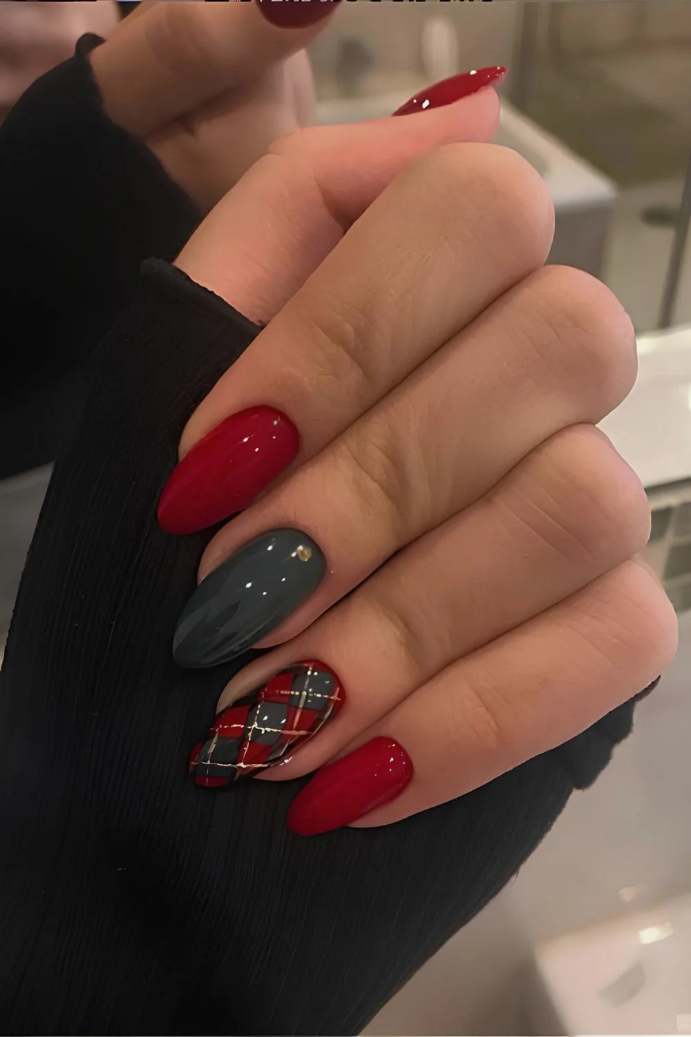 Dark red and green nails with plaid accent