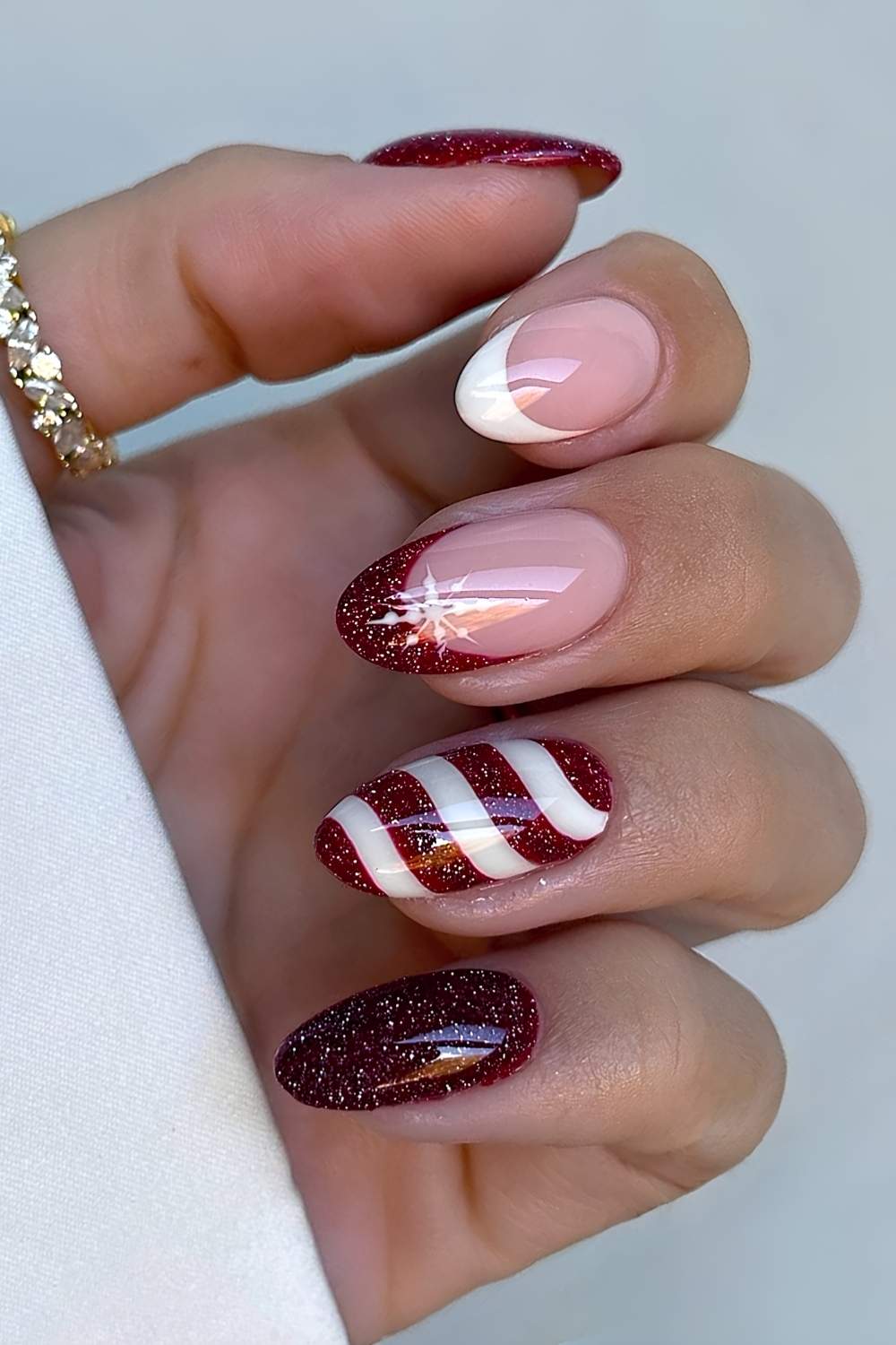 Dark red and white candy cane nails