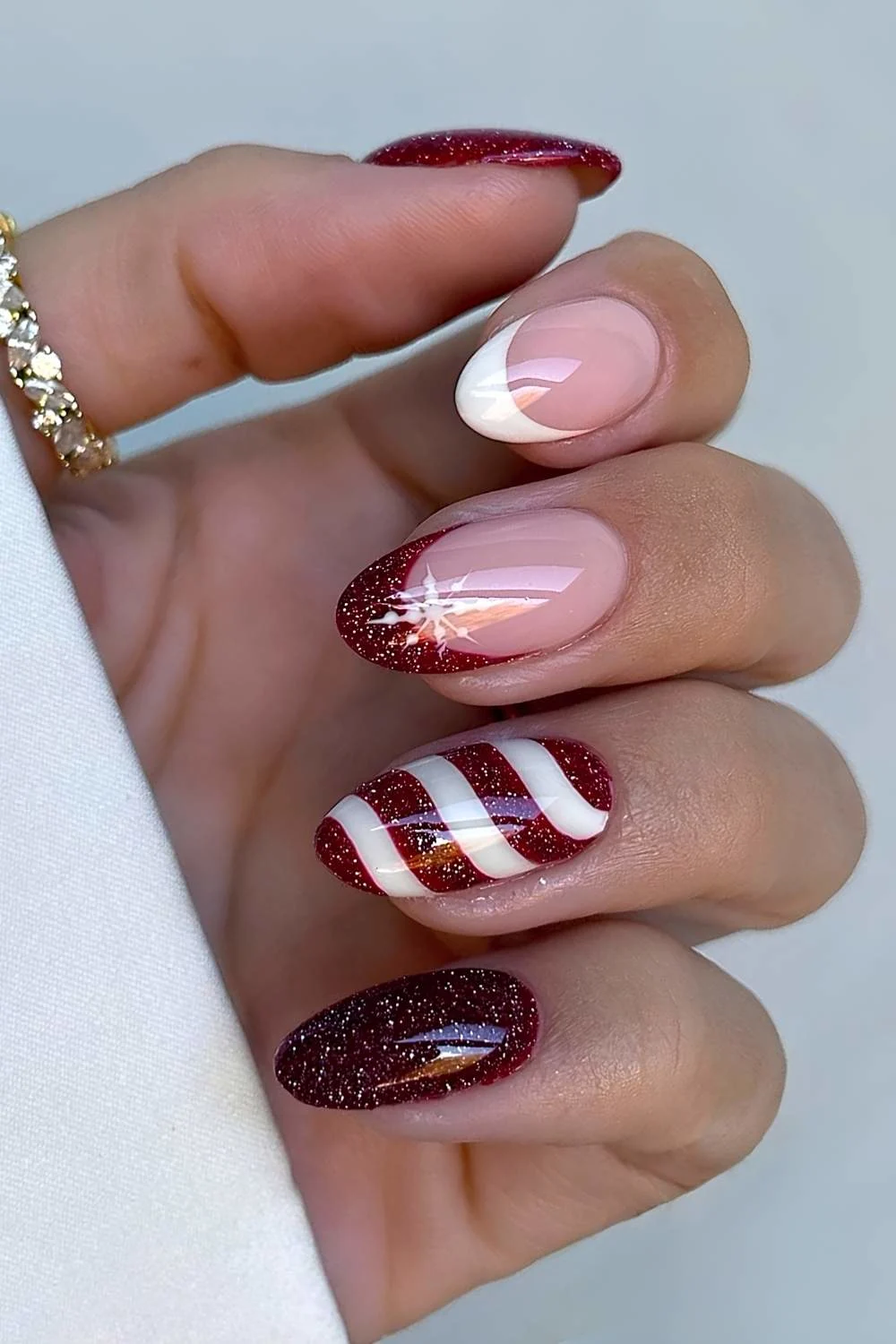 Dark red and white candy cane nails