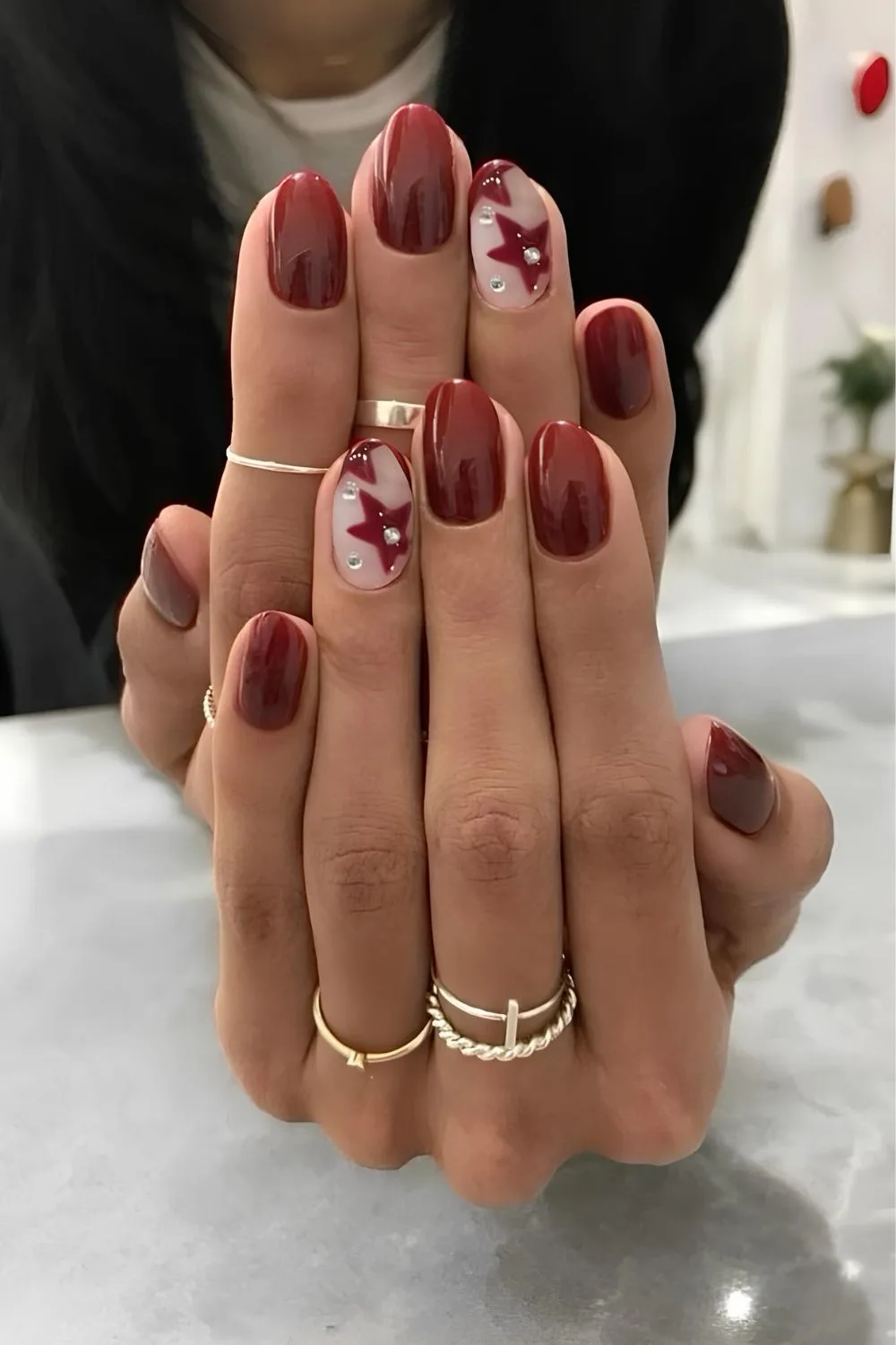 Dark red nails with star art