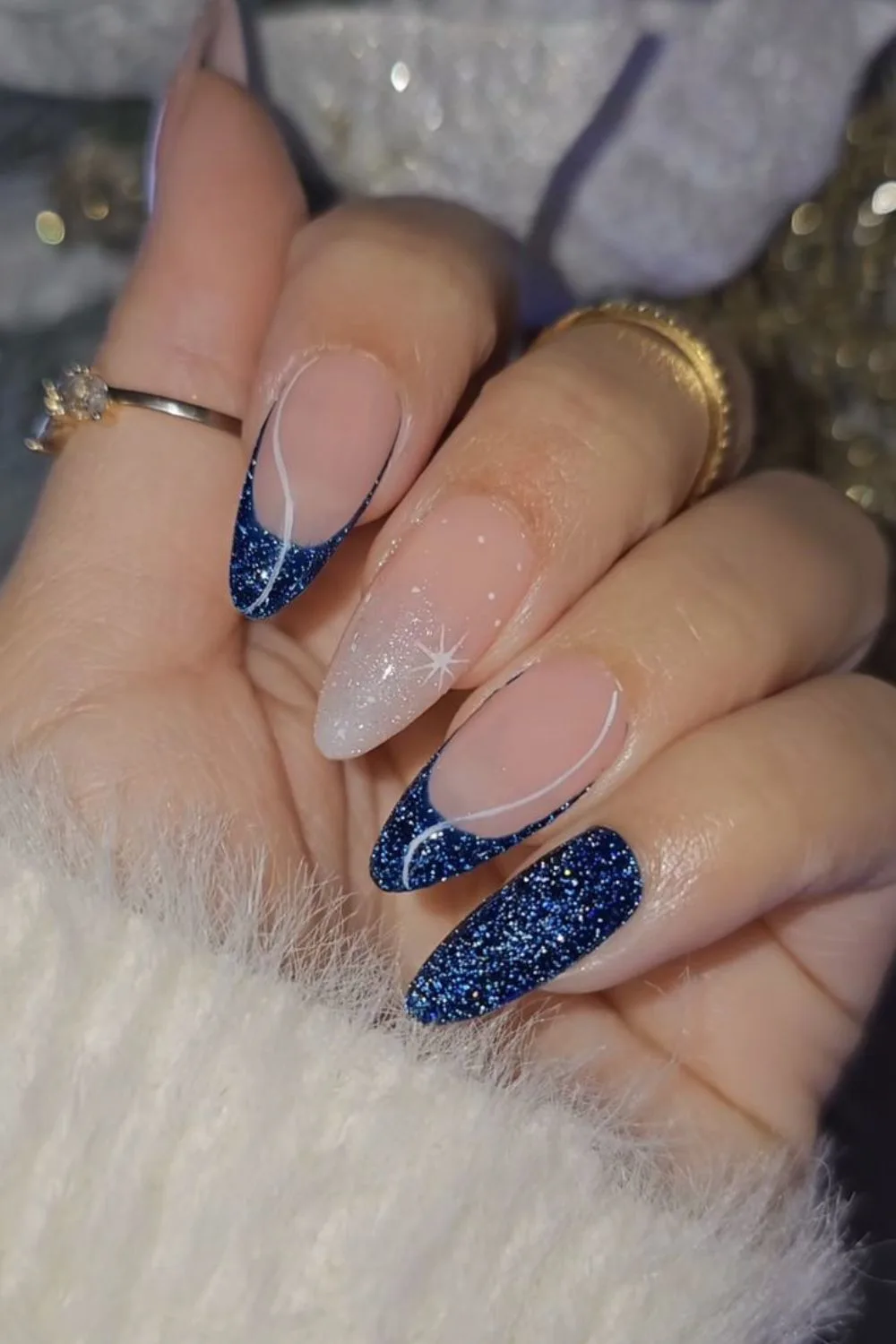 Deep blue sparkly tips with a white starburst accent nail