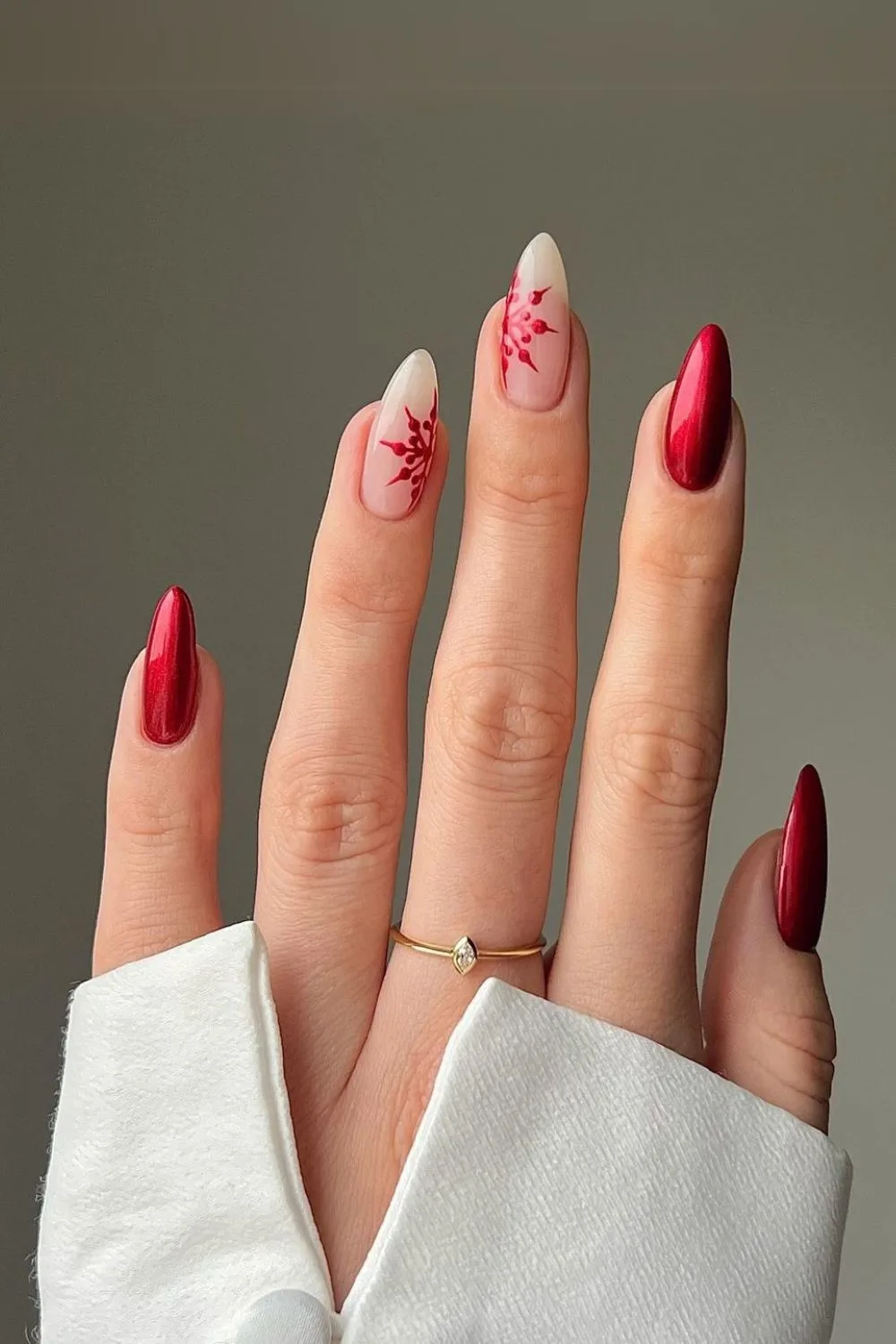 Deep red nails with snowflakes