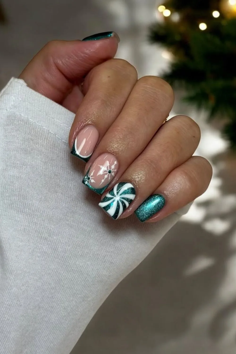 Evergreen velvet nails with glitter and candy cane accent