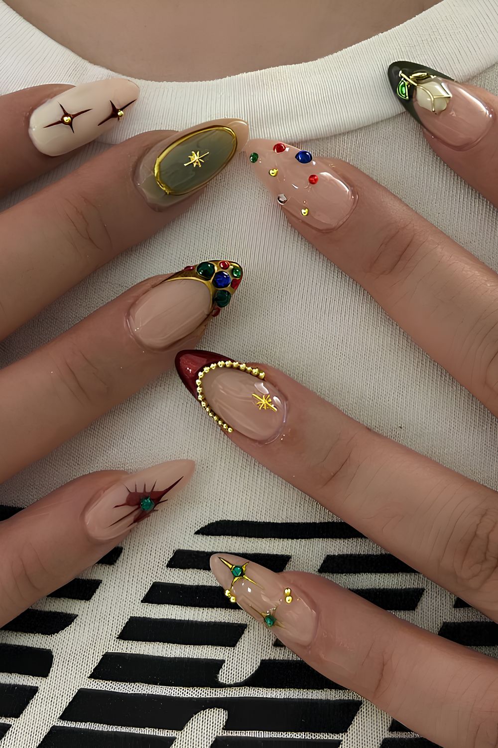 French tip nails with festive red, green and gold chrome accents