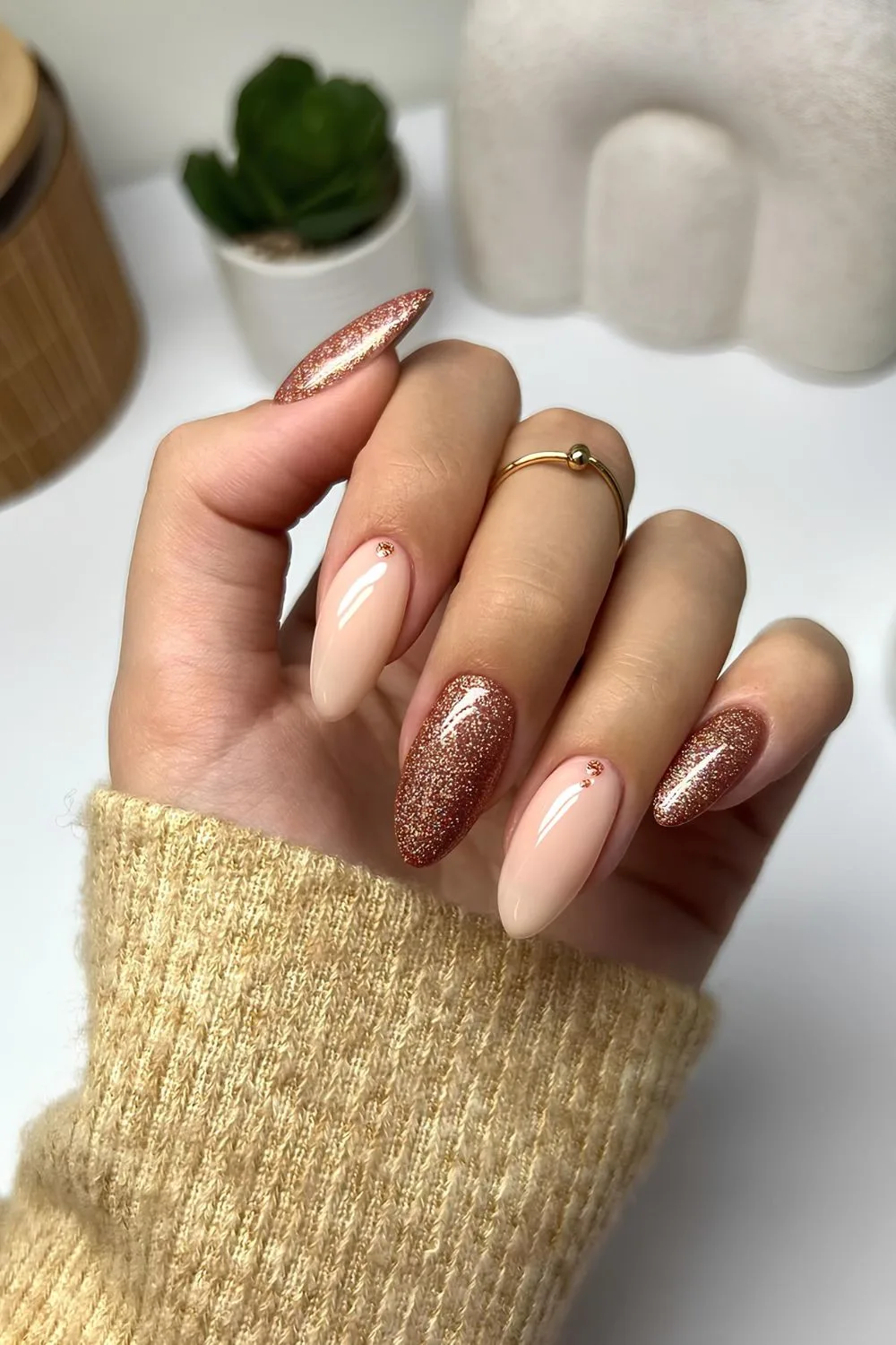 Glittery brown nails with dot accents