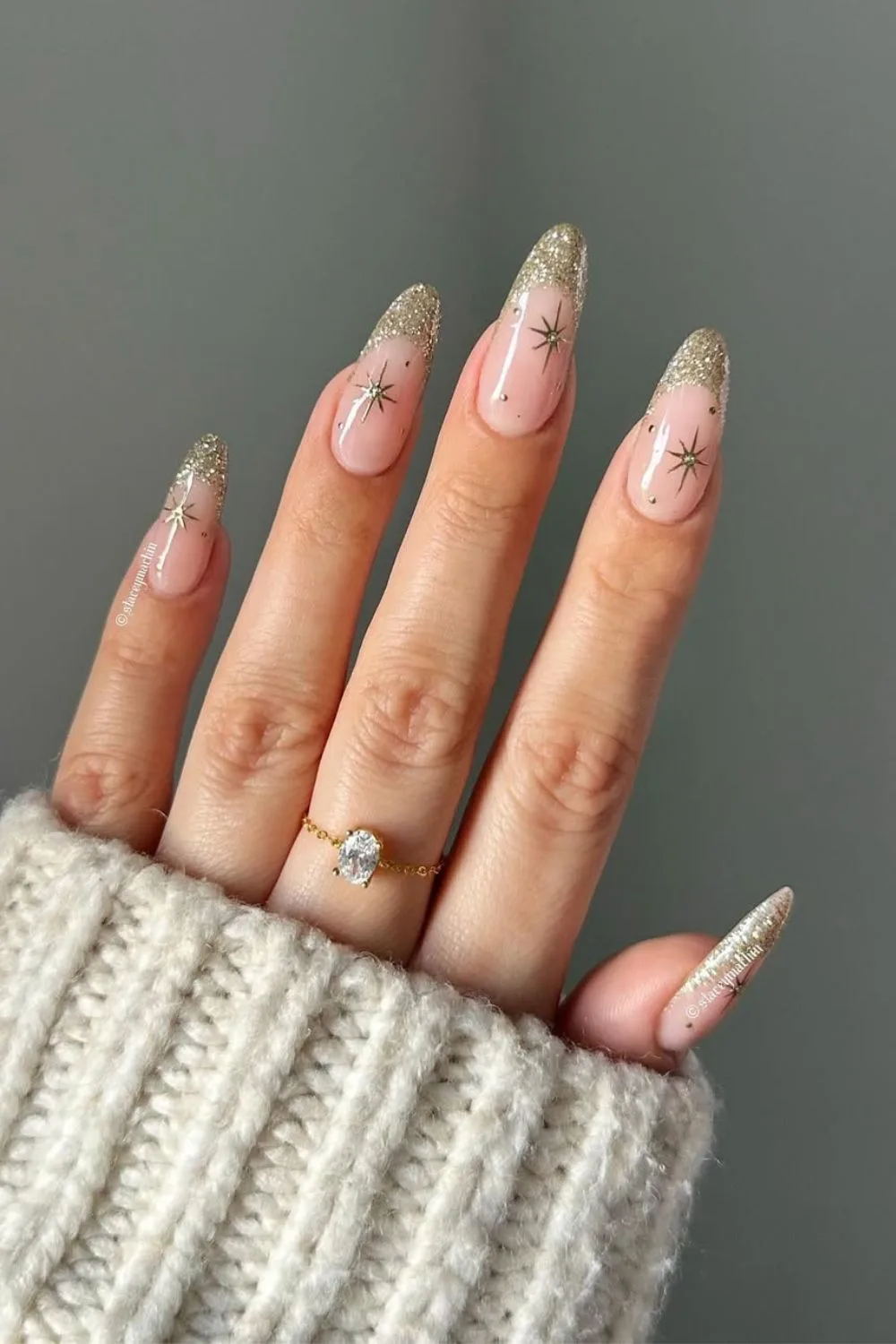 Glittery gold French mani with celestial accents