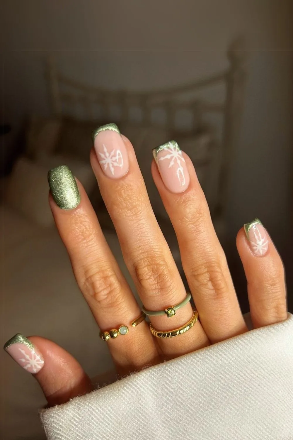 Glittery green nails with snowflakes