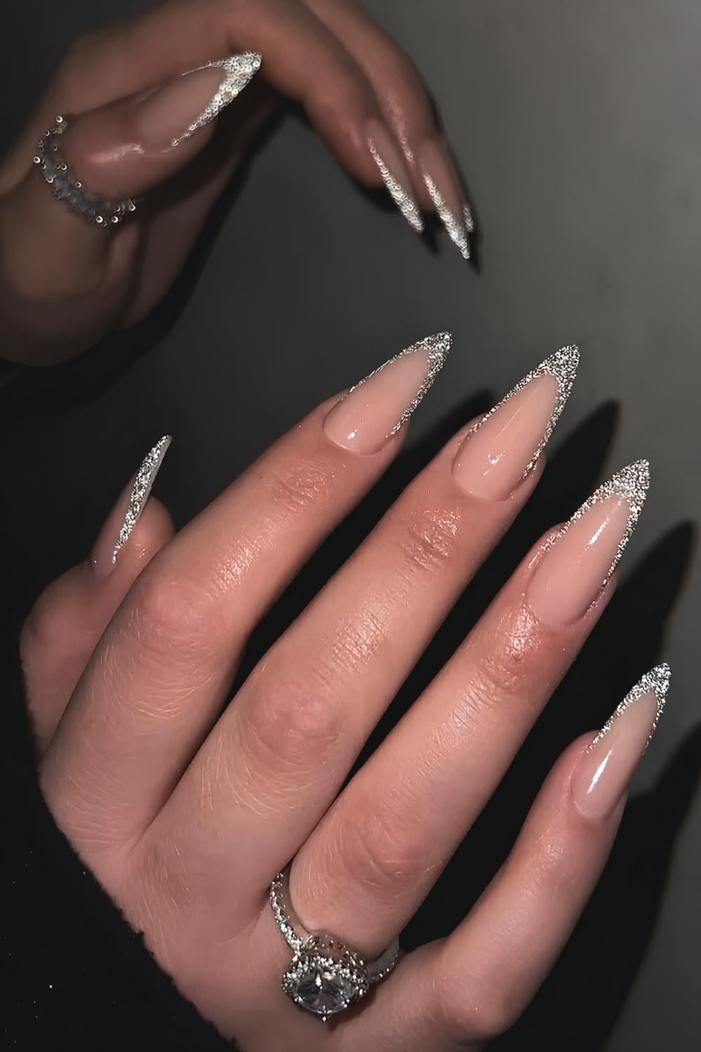 Glittery silver French tip manicure