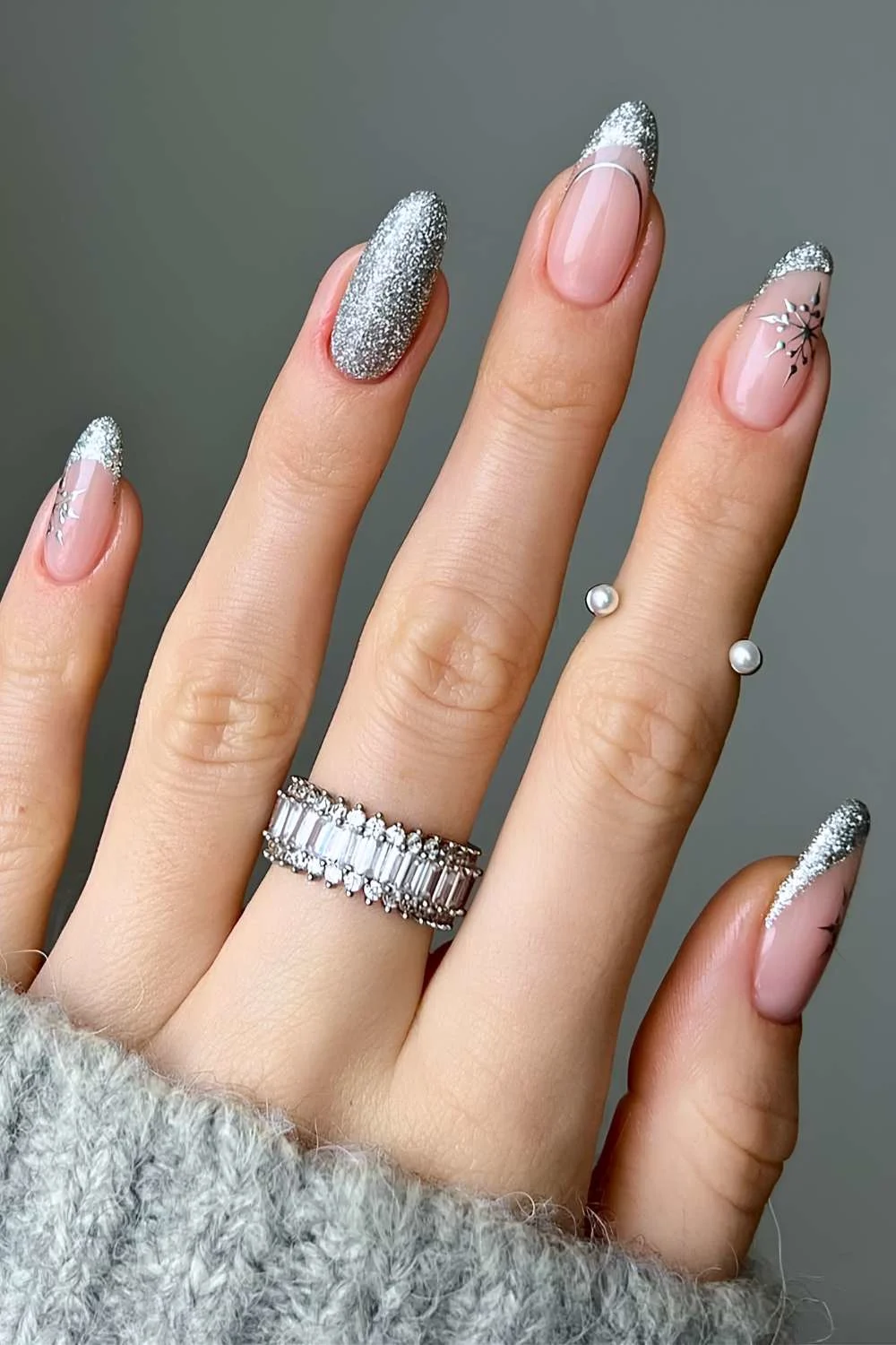 Glittery silver manicure with snowflakes