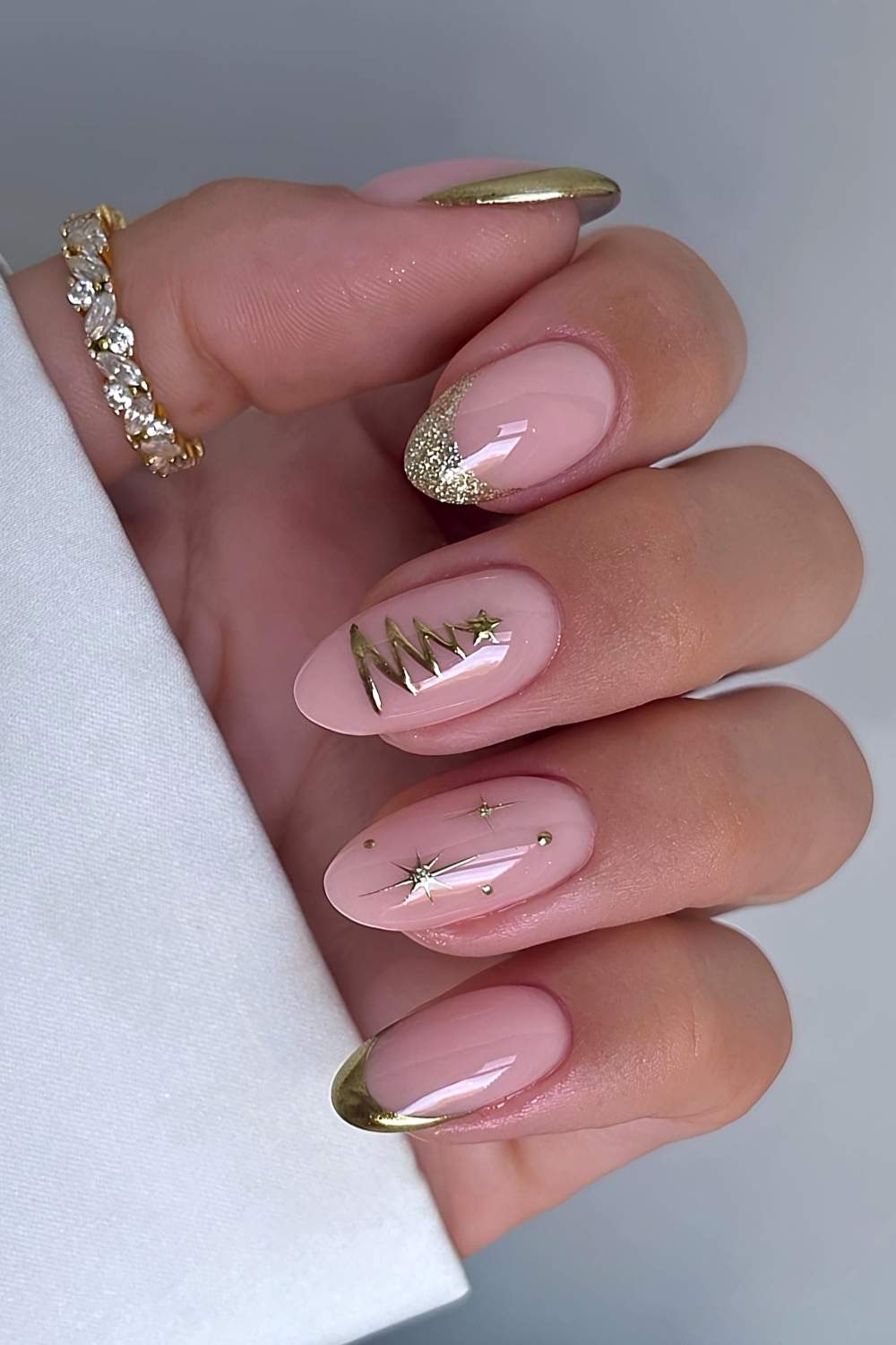 Gold French nails with Christmas-themed details