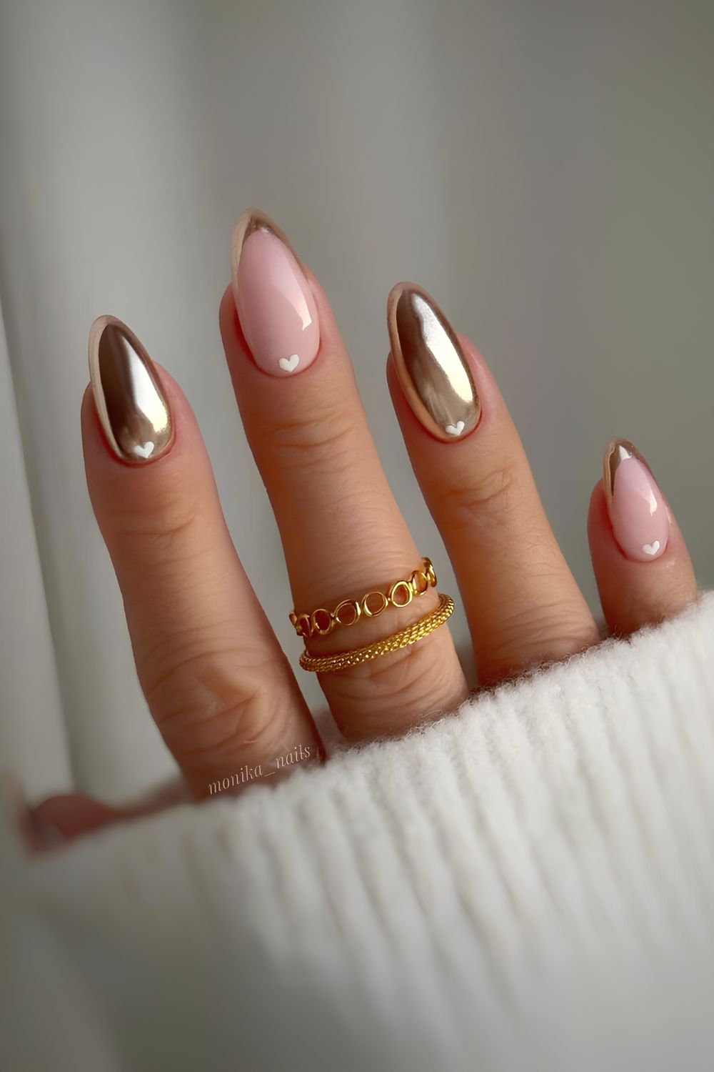 Gold French nails with heart accents