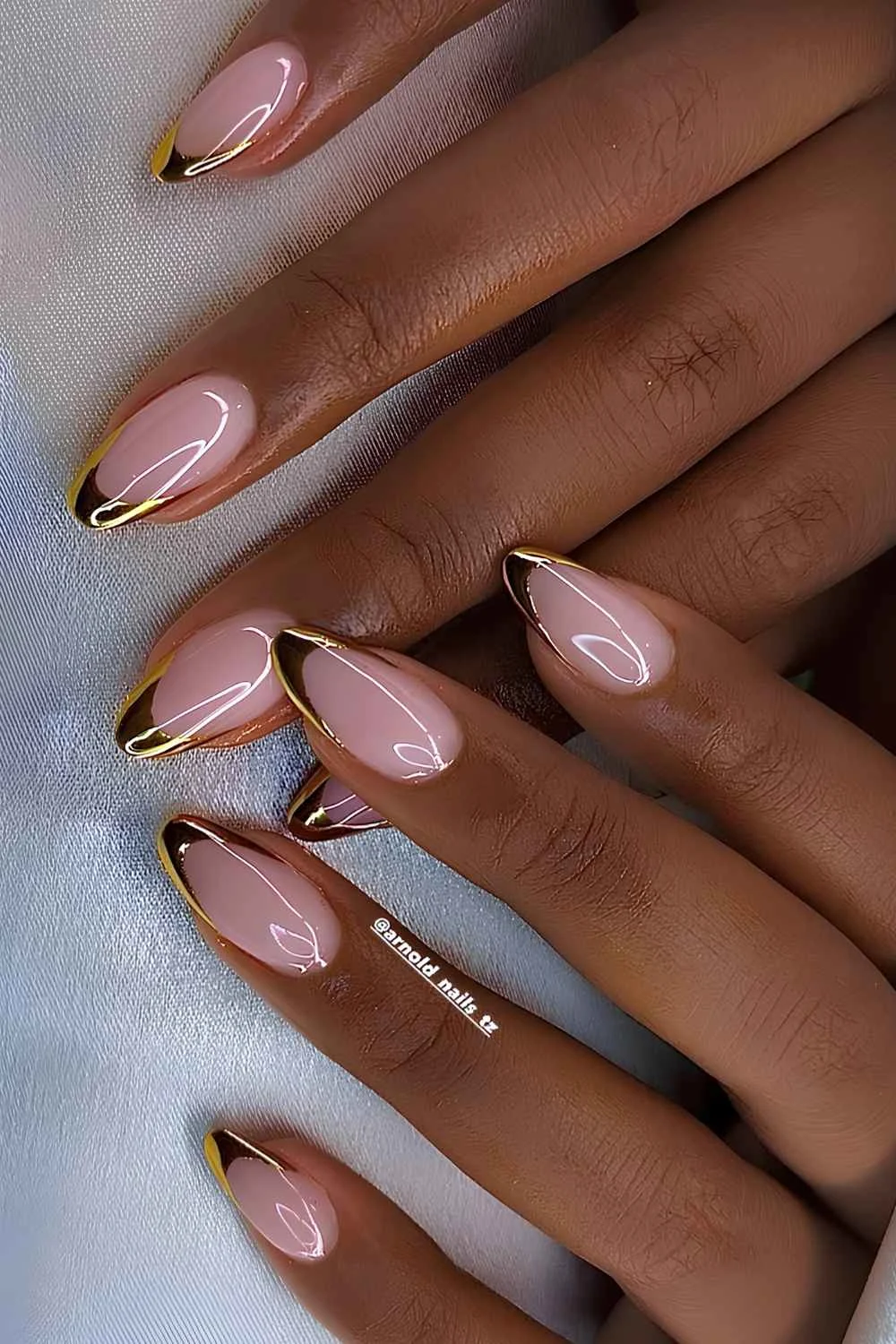 Gold French tip mani on pink base