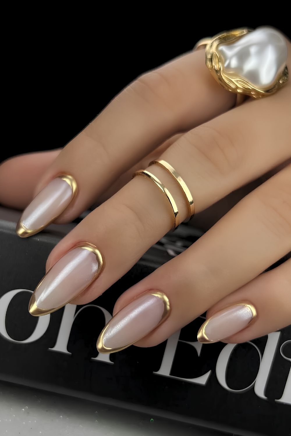 Gold border French tip mani on a white base