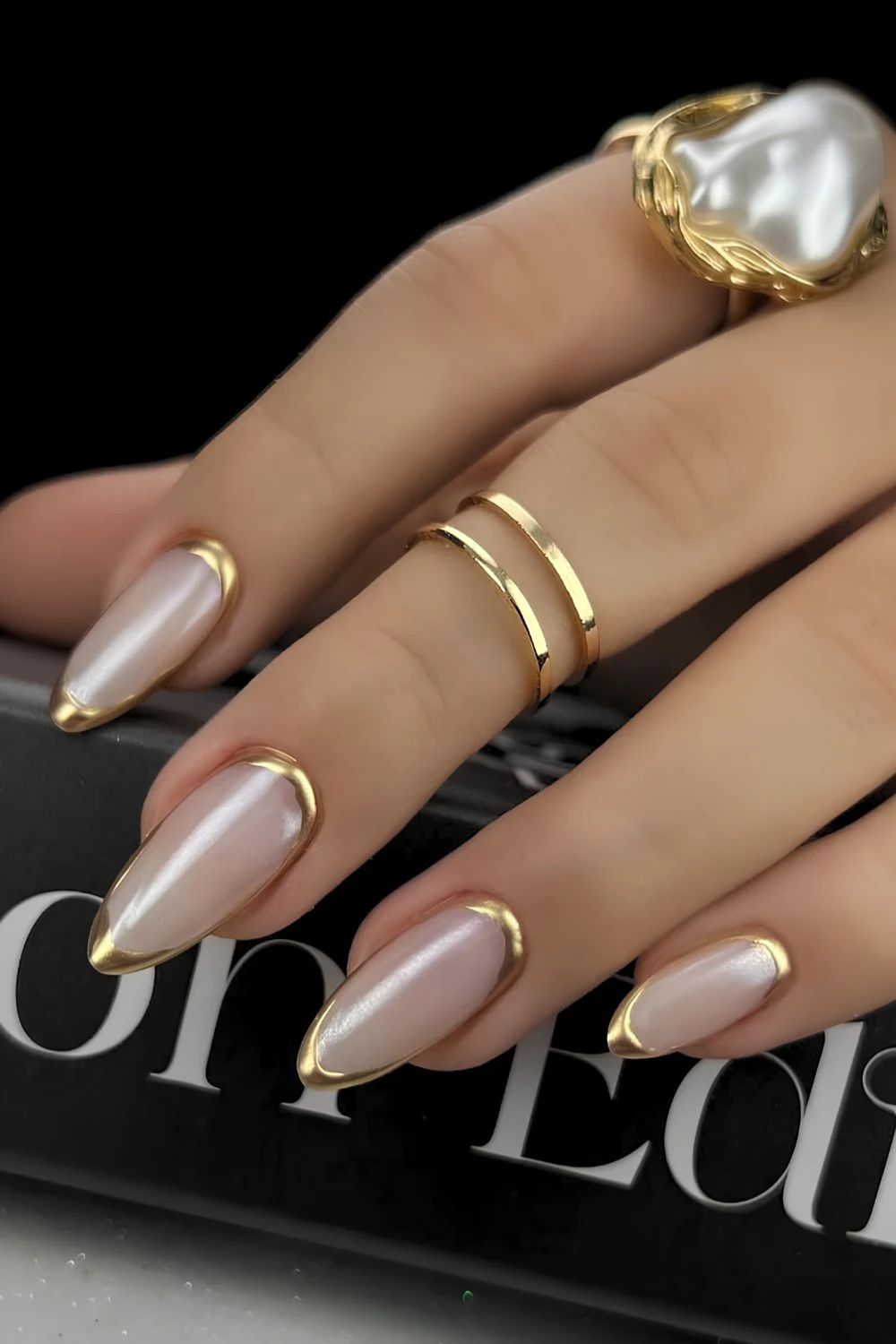 Gold border French tip mani on a white base