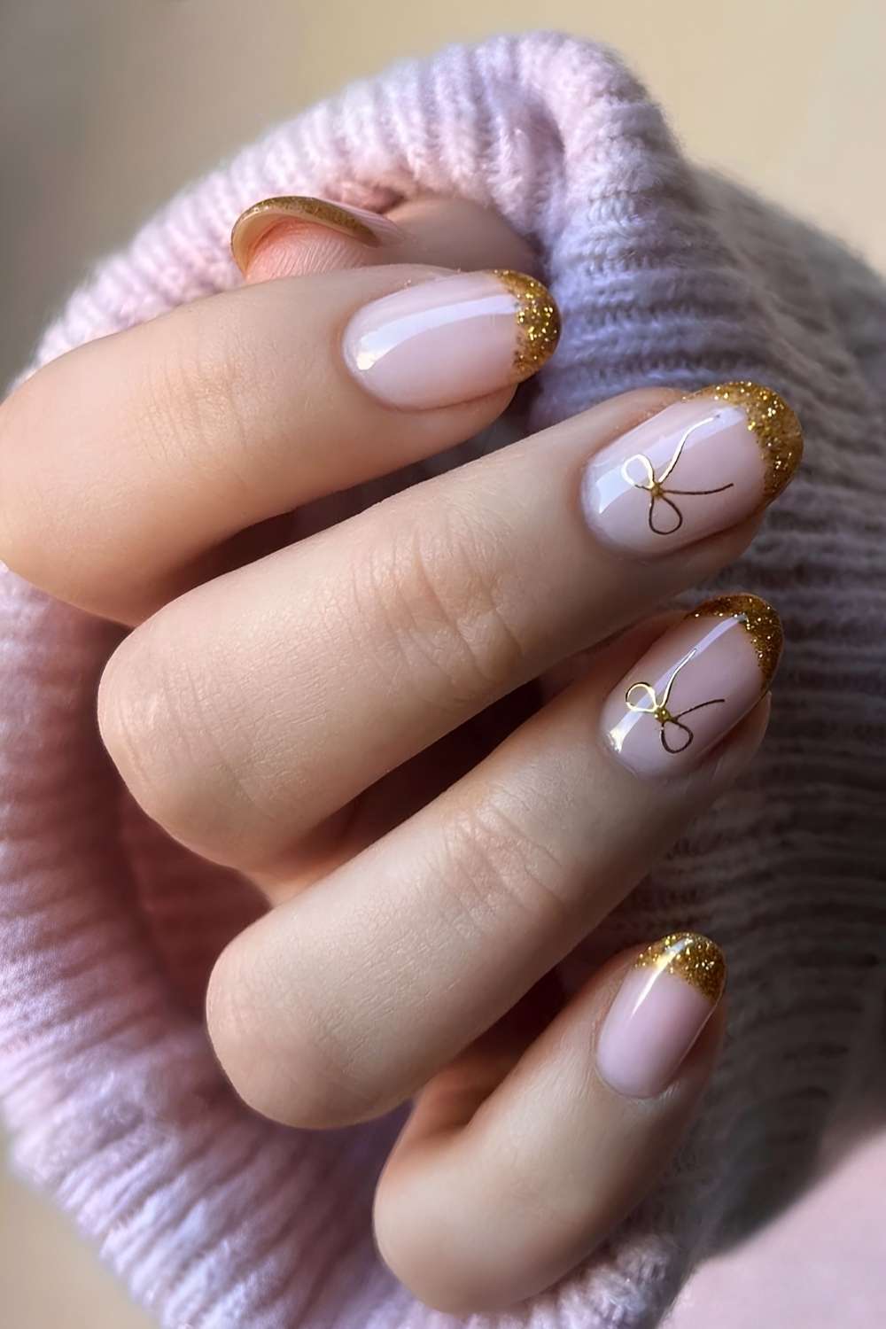 Gold glitter French nails with bow art