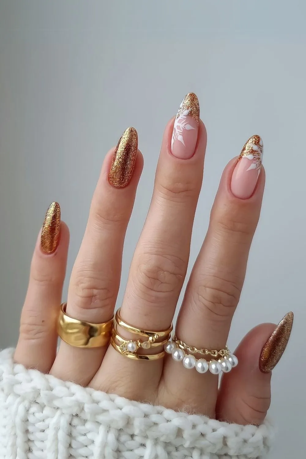 Gold nails with snowflake accents