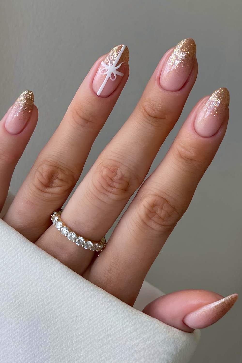Gold ombre nails with gift bow art