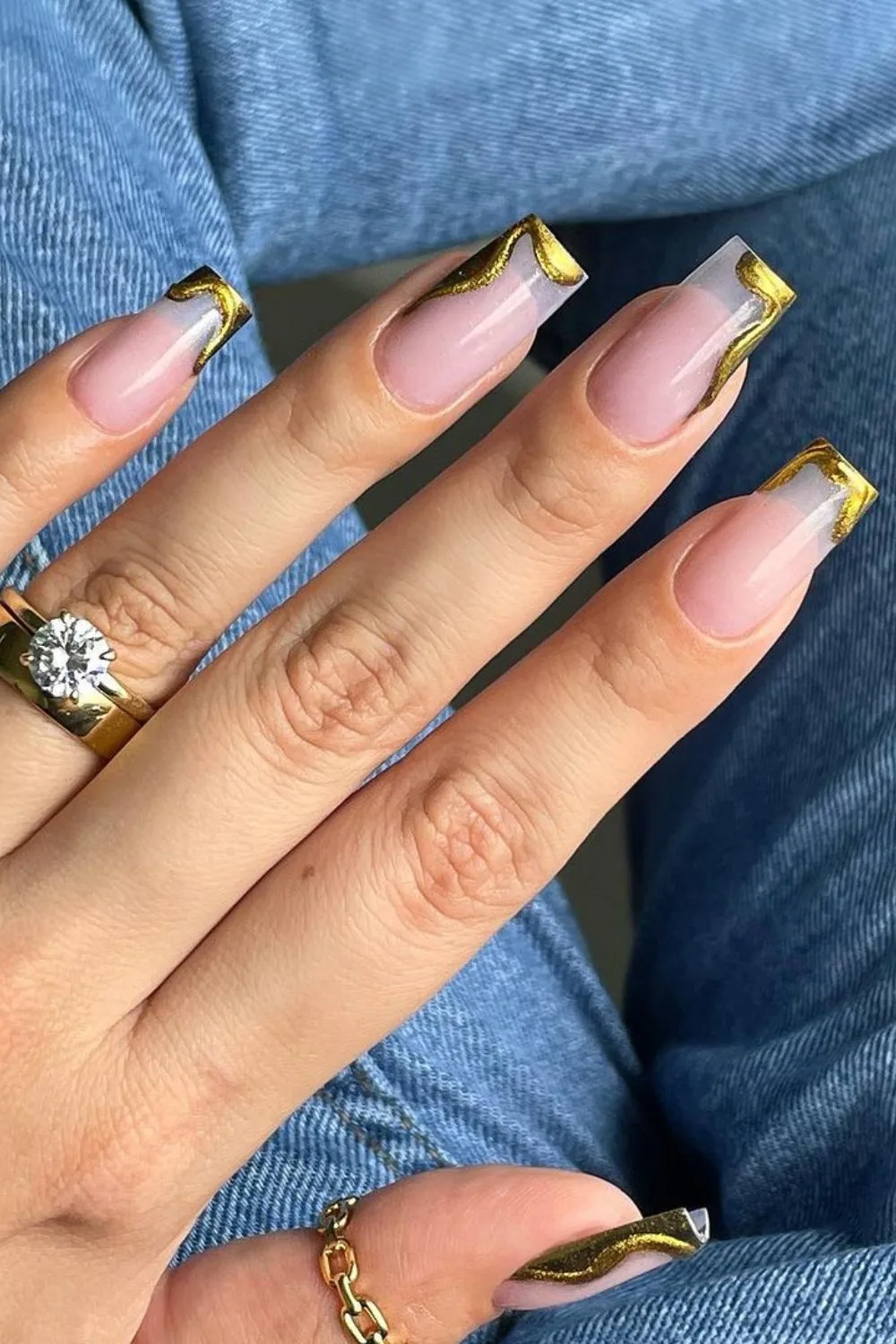 Gold swirly French tip nails