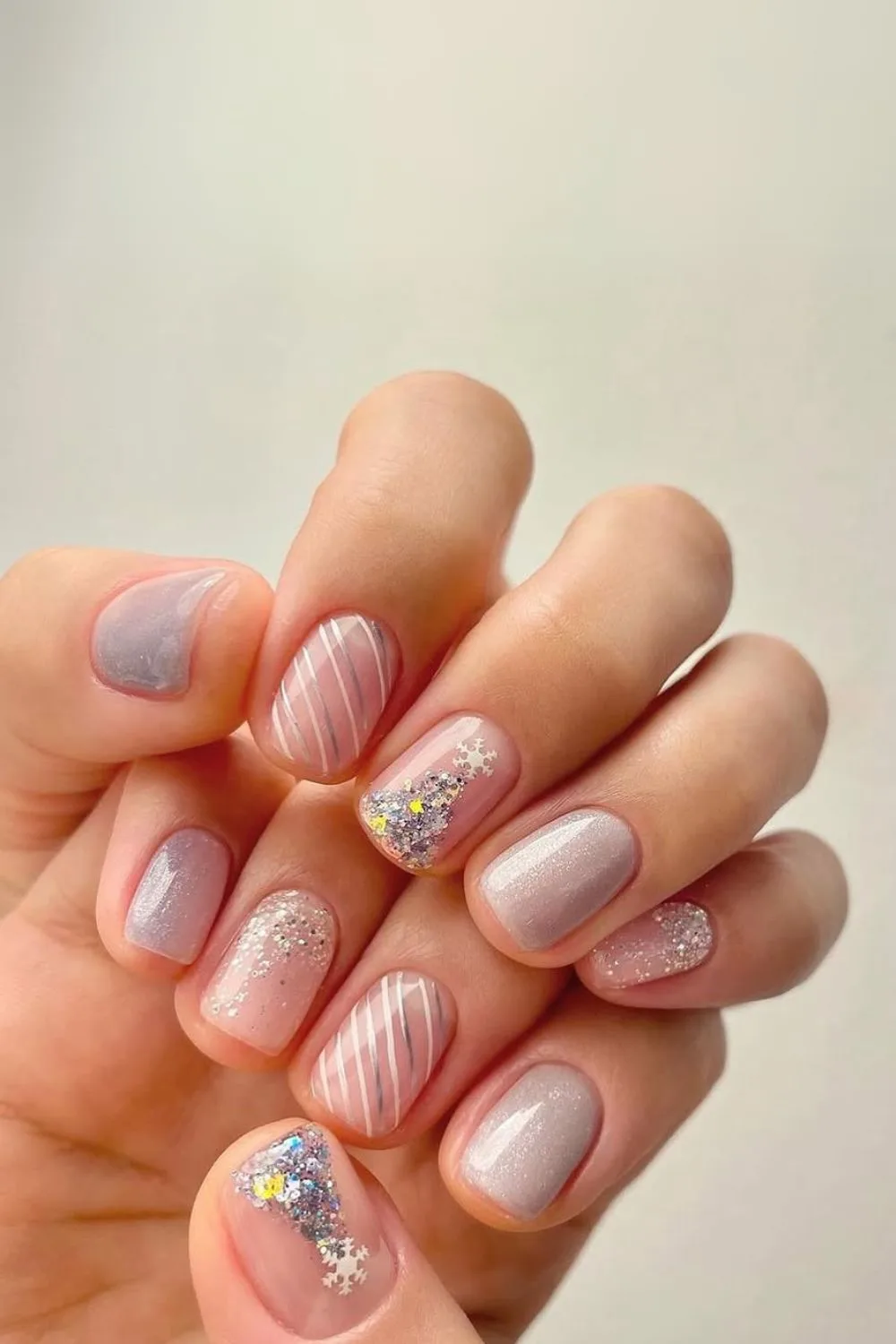 Gray and silver nails with stripes and Christmas trees