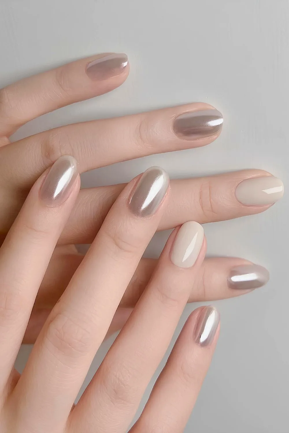 Gray chrome nails with milky white accents