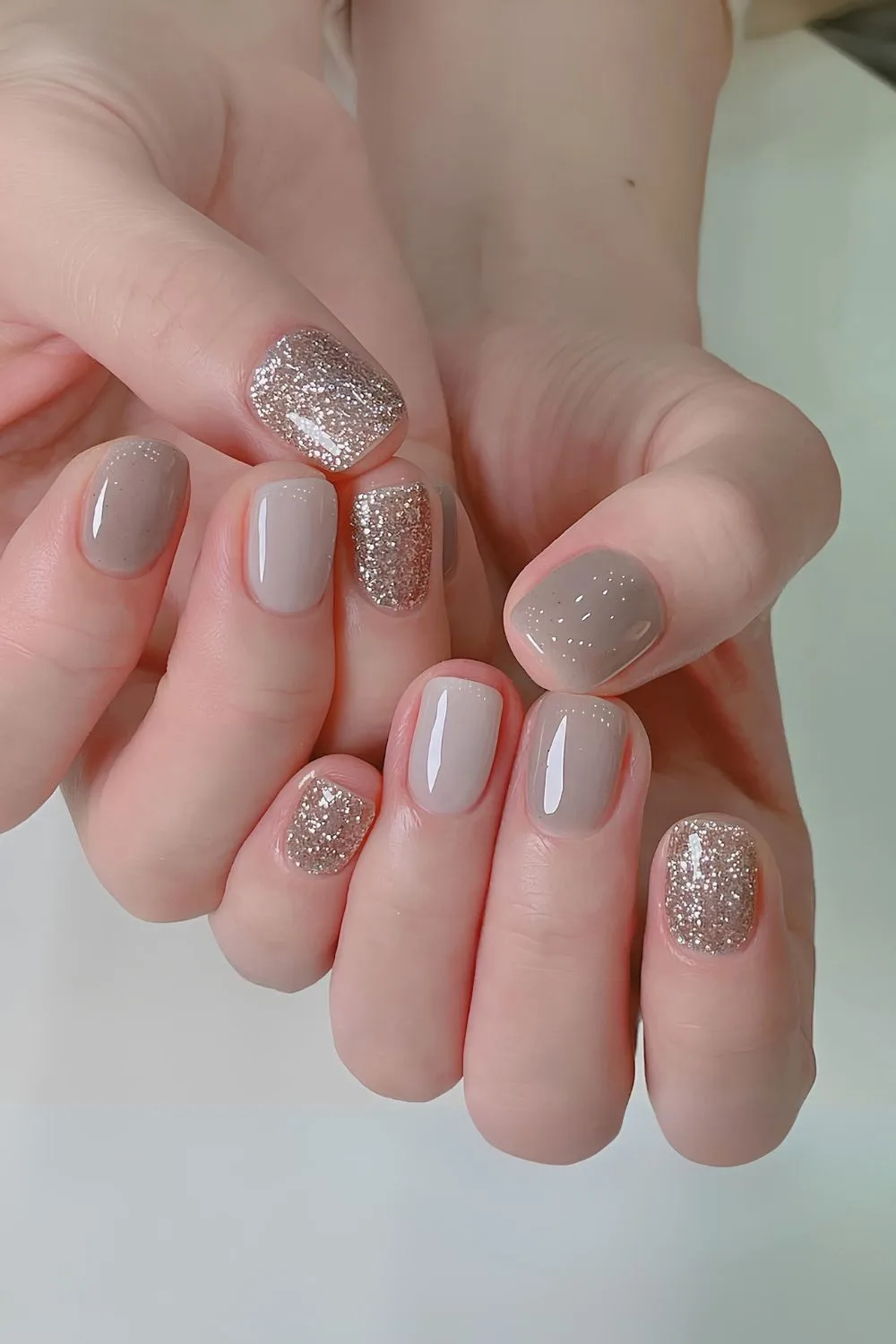 Gray nails with glitter accents