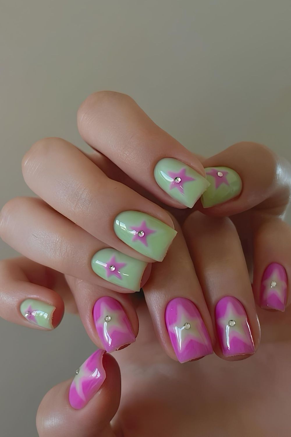 Green and pink nails with star accent