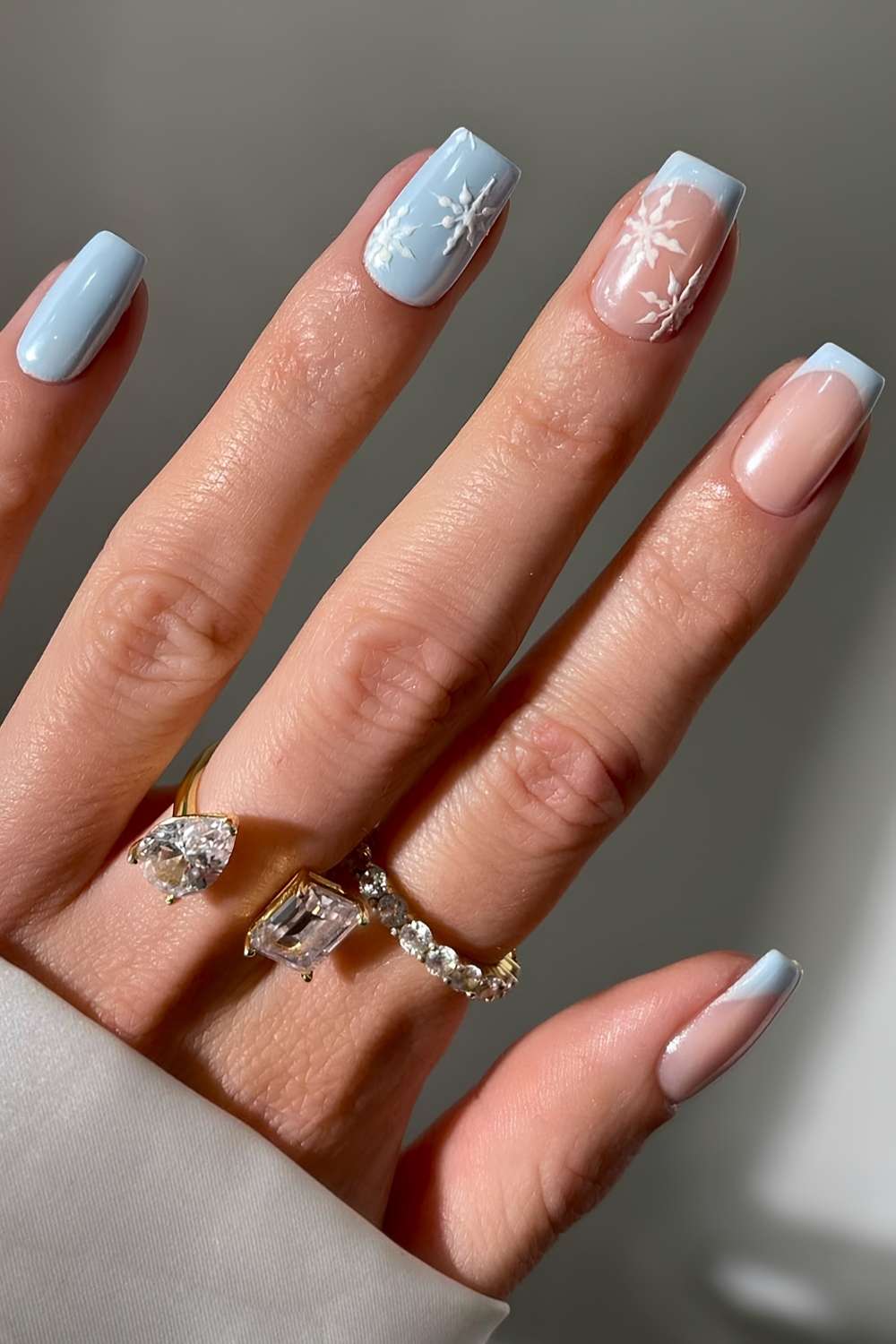 Light blue Christmas nails with snowflakes