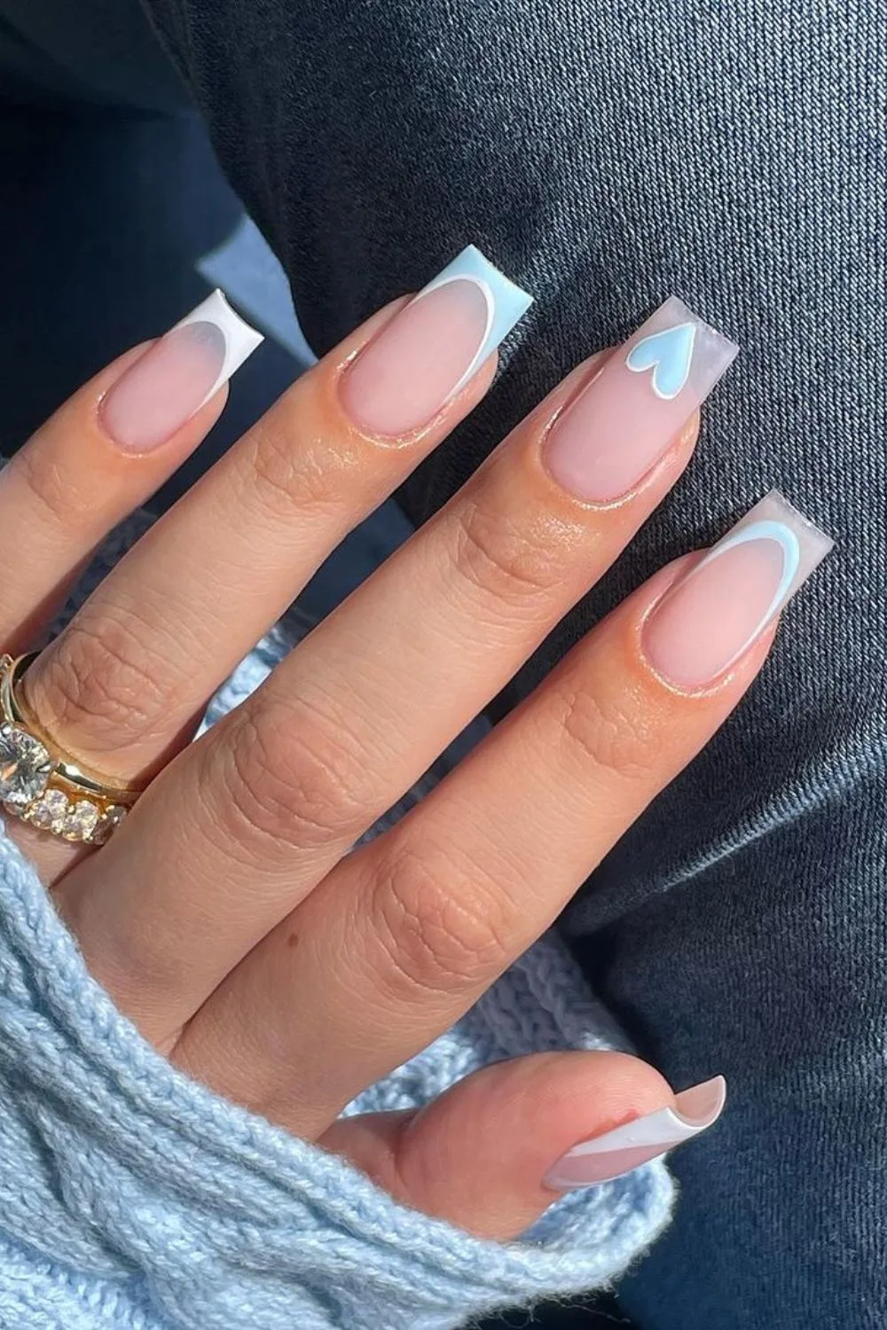 Light blue French tip nails with heart accent