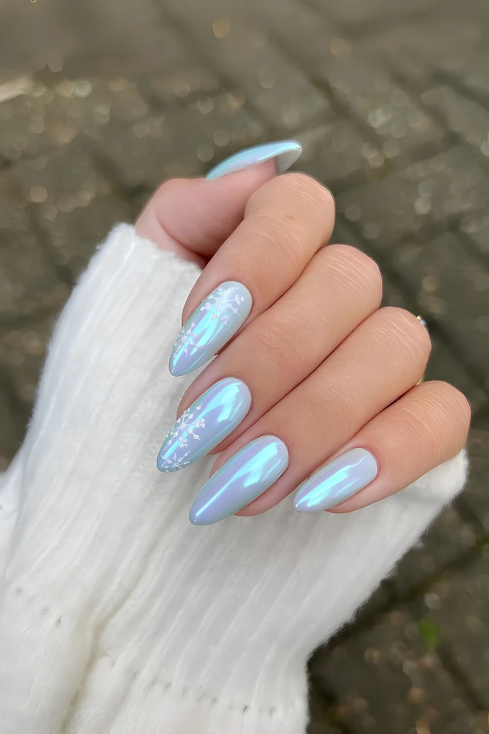 Light blue chrome nails with snowflakes