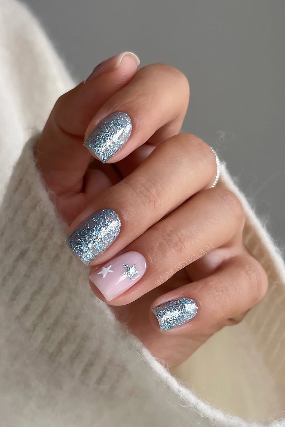 Light blue glitter nails with star accents