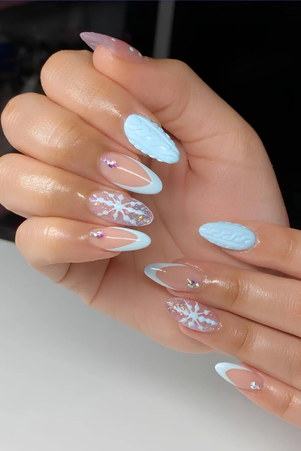 Light blue nails with snowflakes