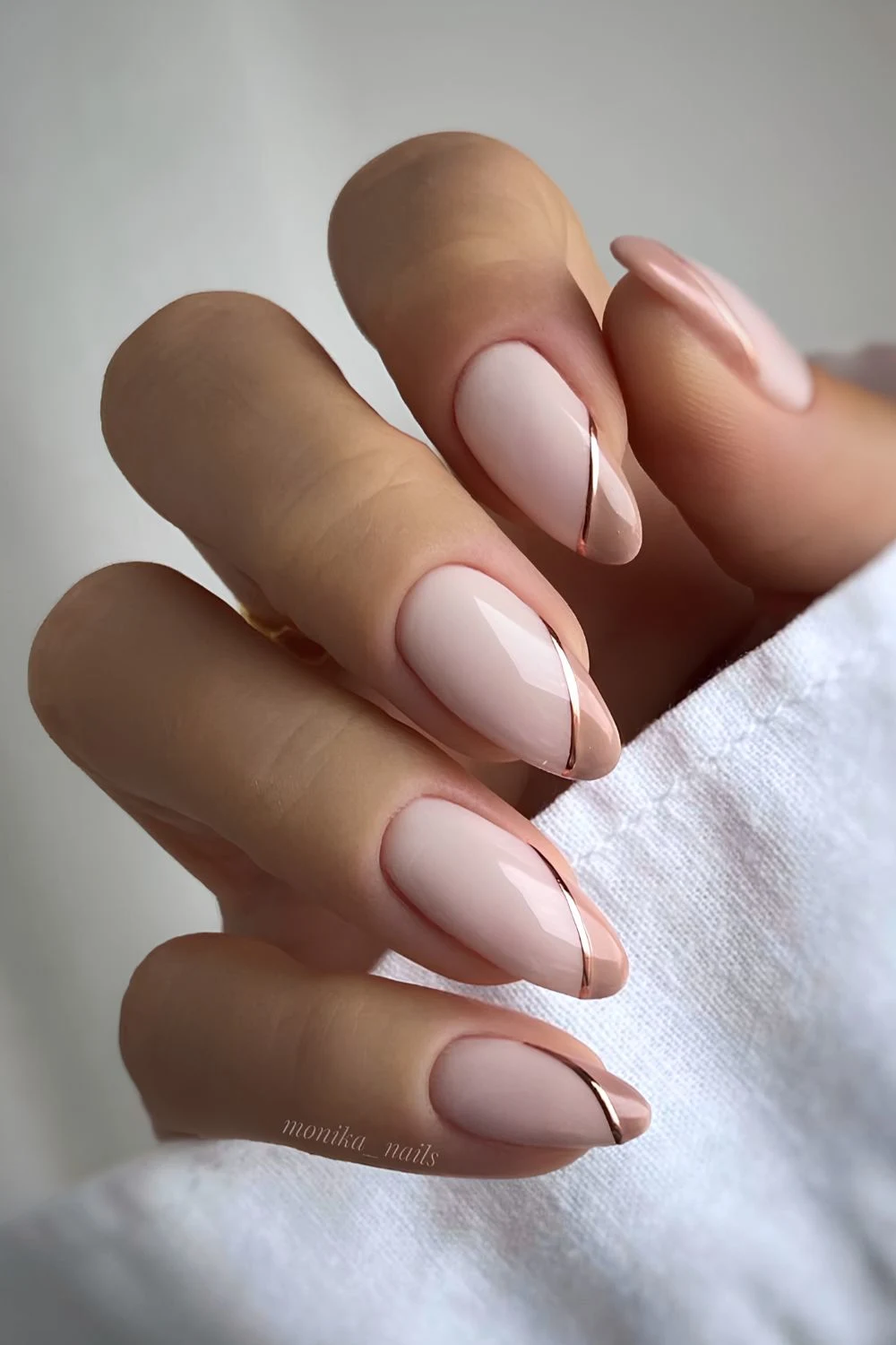 Light brown side French mani with gold accents