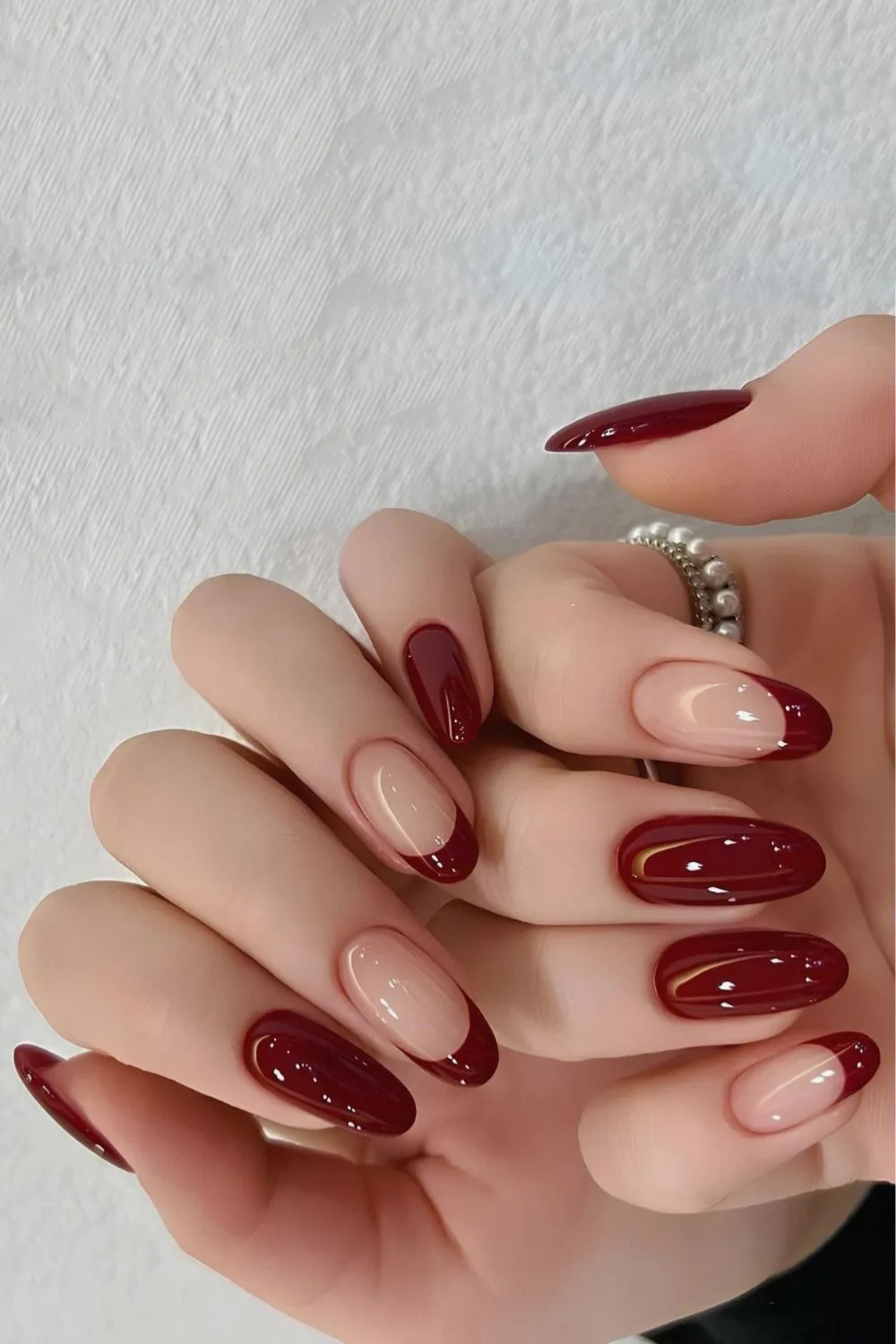 Maroon red mani with accent French tips