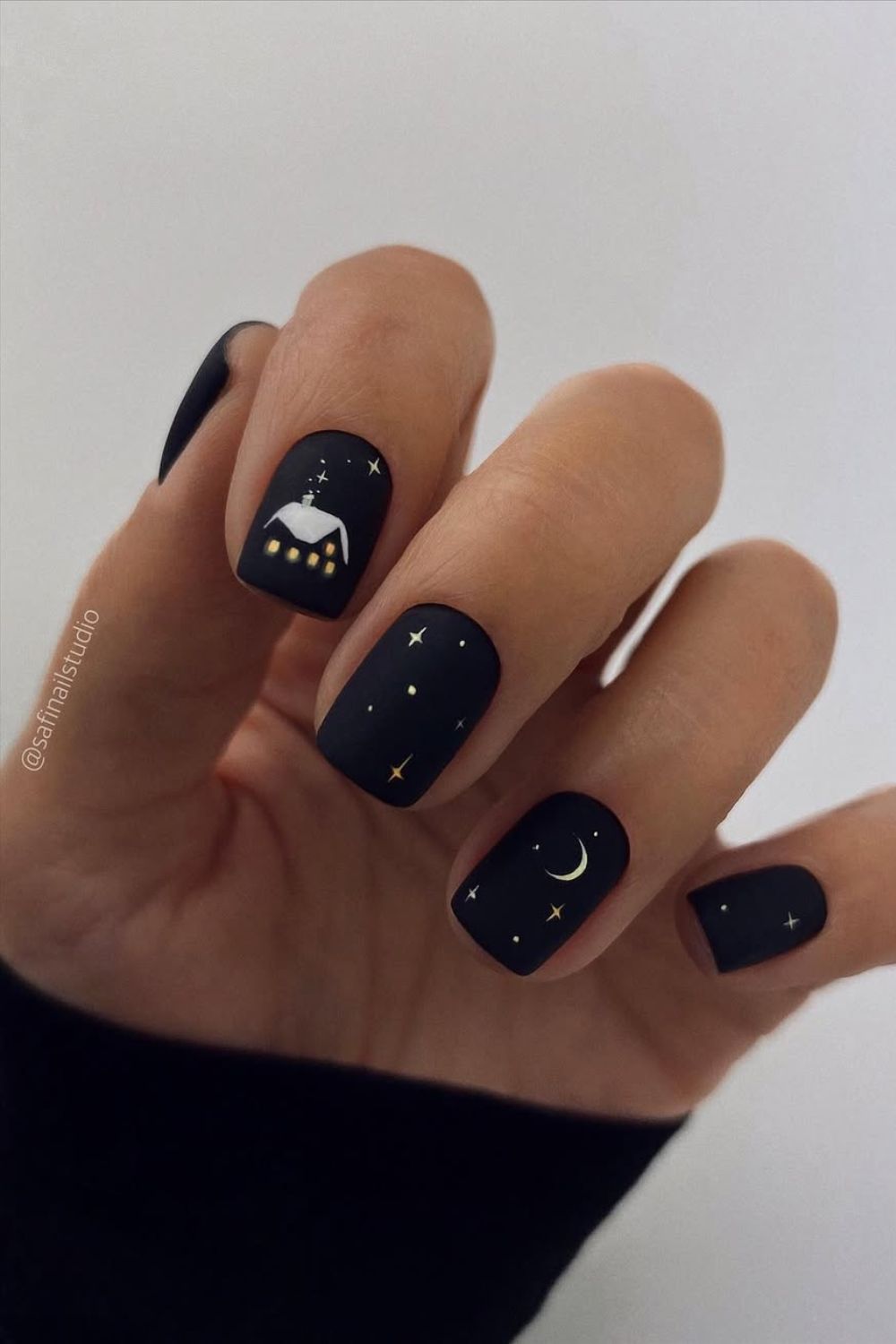 Matte black nails with Christmas art