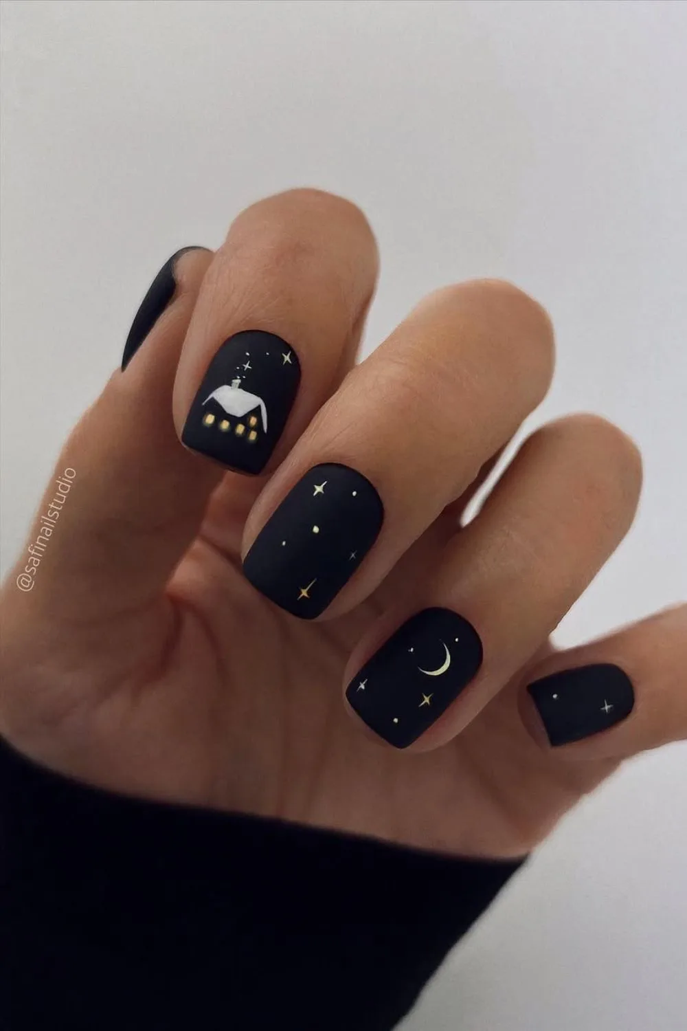 Matte black nails with Christmas art