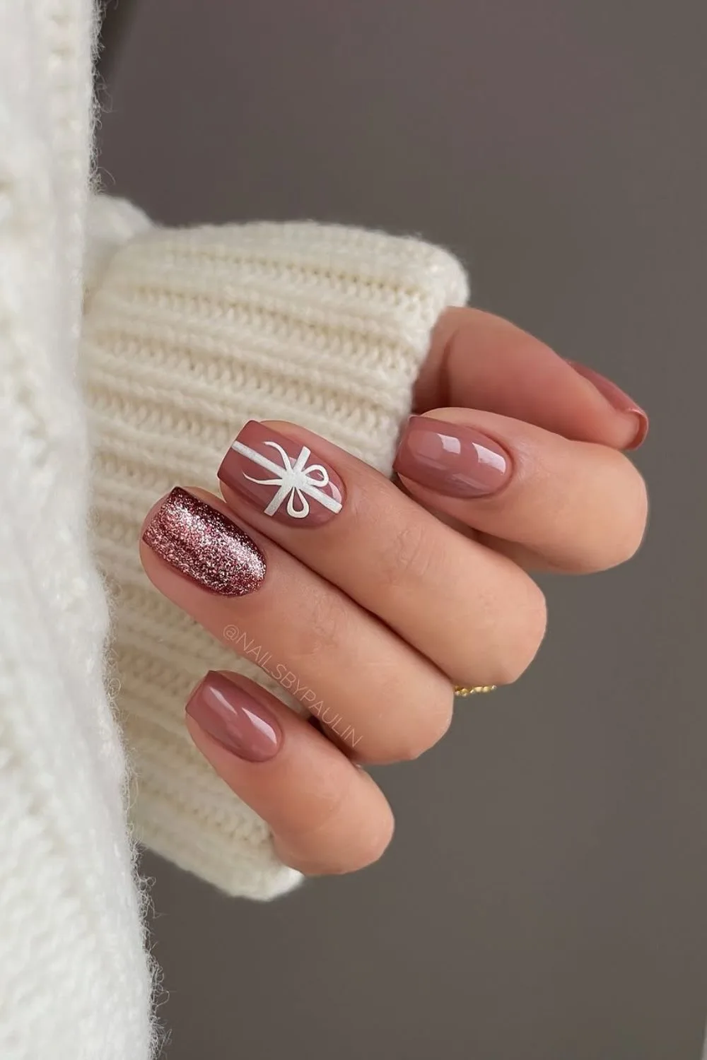 Mauve nails with glitter and gift bow art