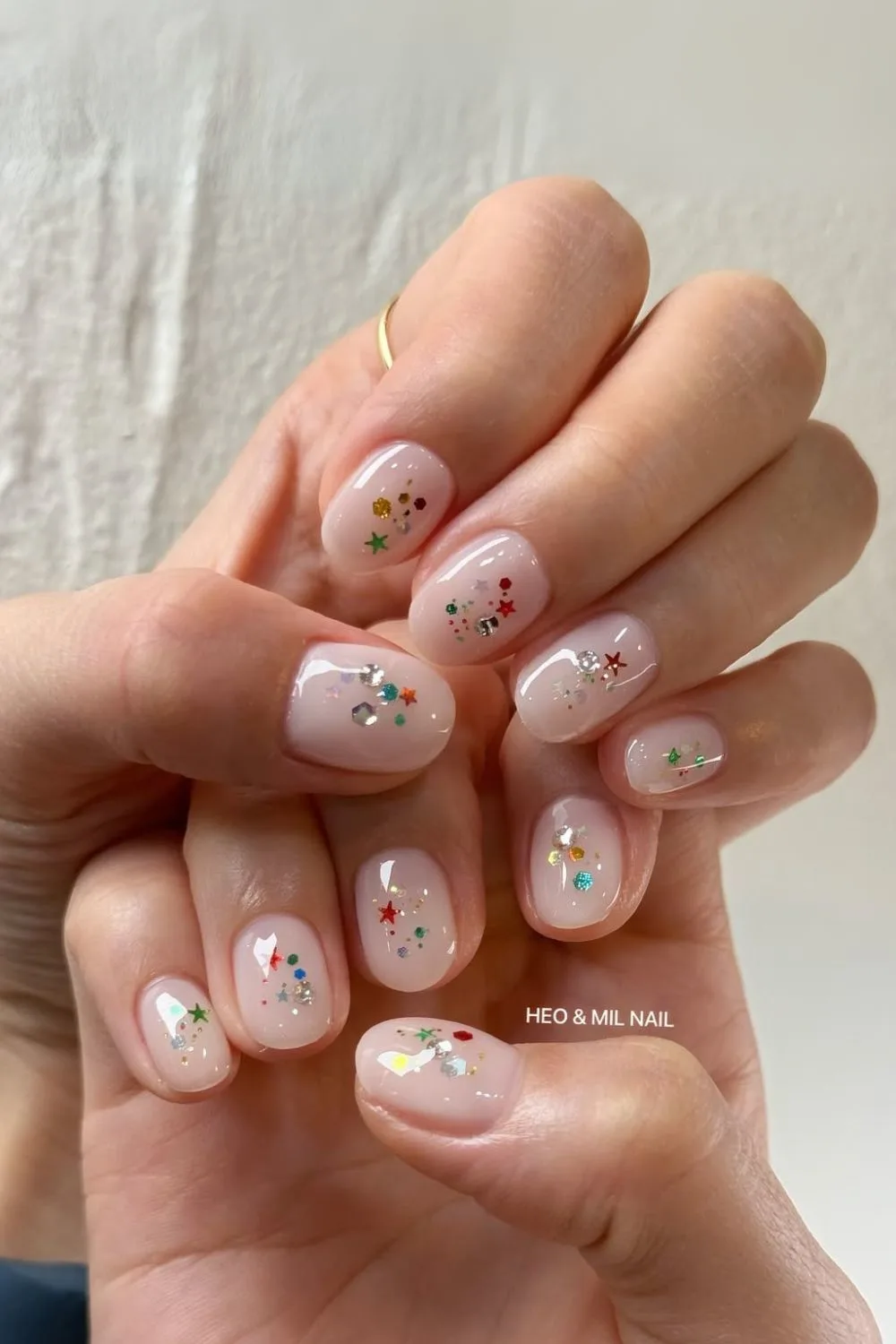 Milky nails with colorful glitter