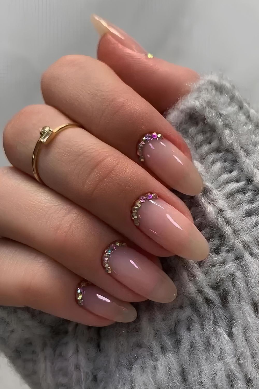 Milky pink nails with crystal accents