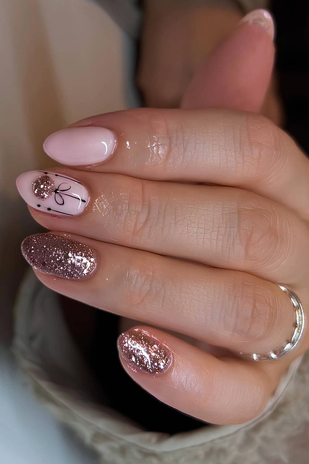 Milky pink nails with glitter and Christmas bauble art