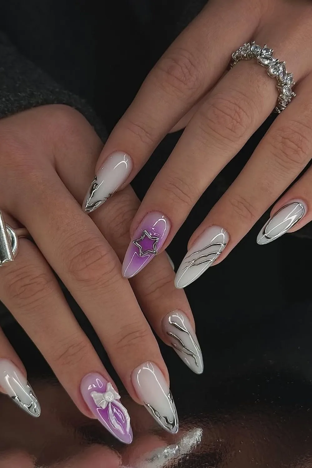 Milky white and purple nails with chrome accents