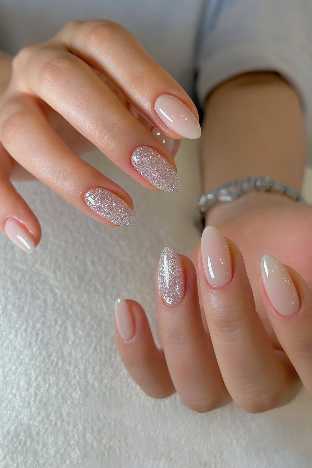 Milky white nails with glitter accents