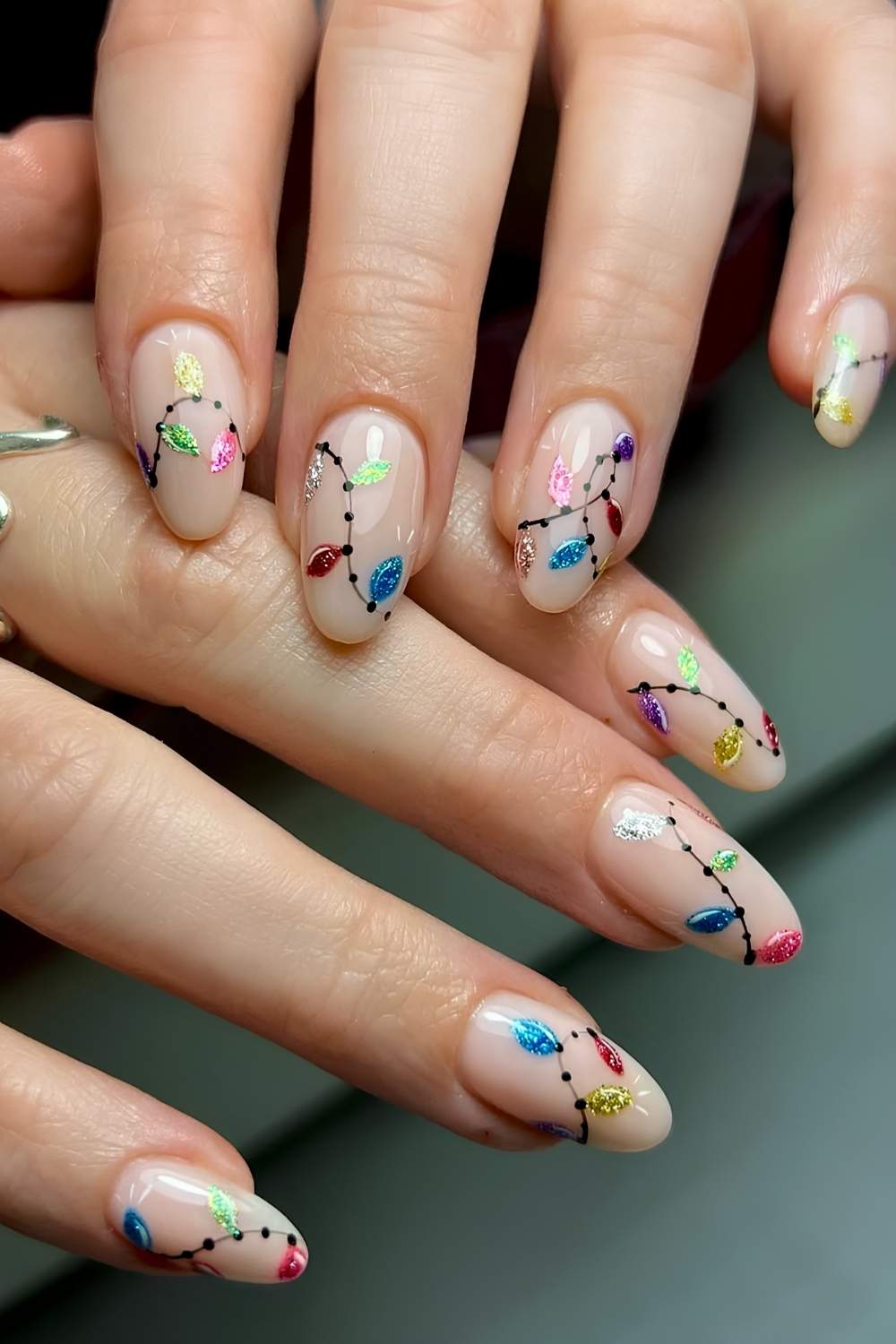 Milky white nails with glittery Christmas light art