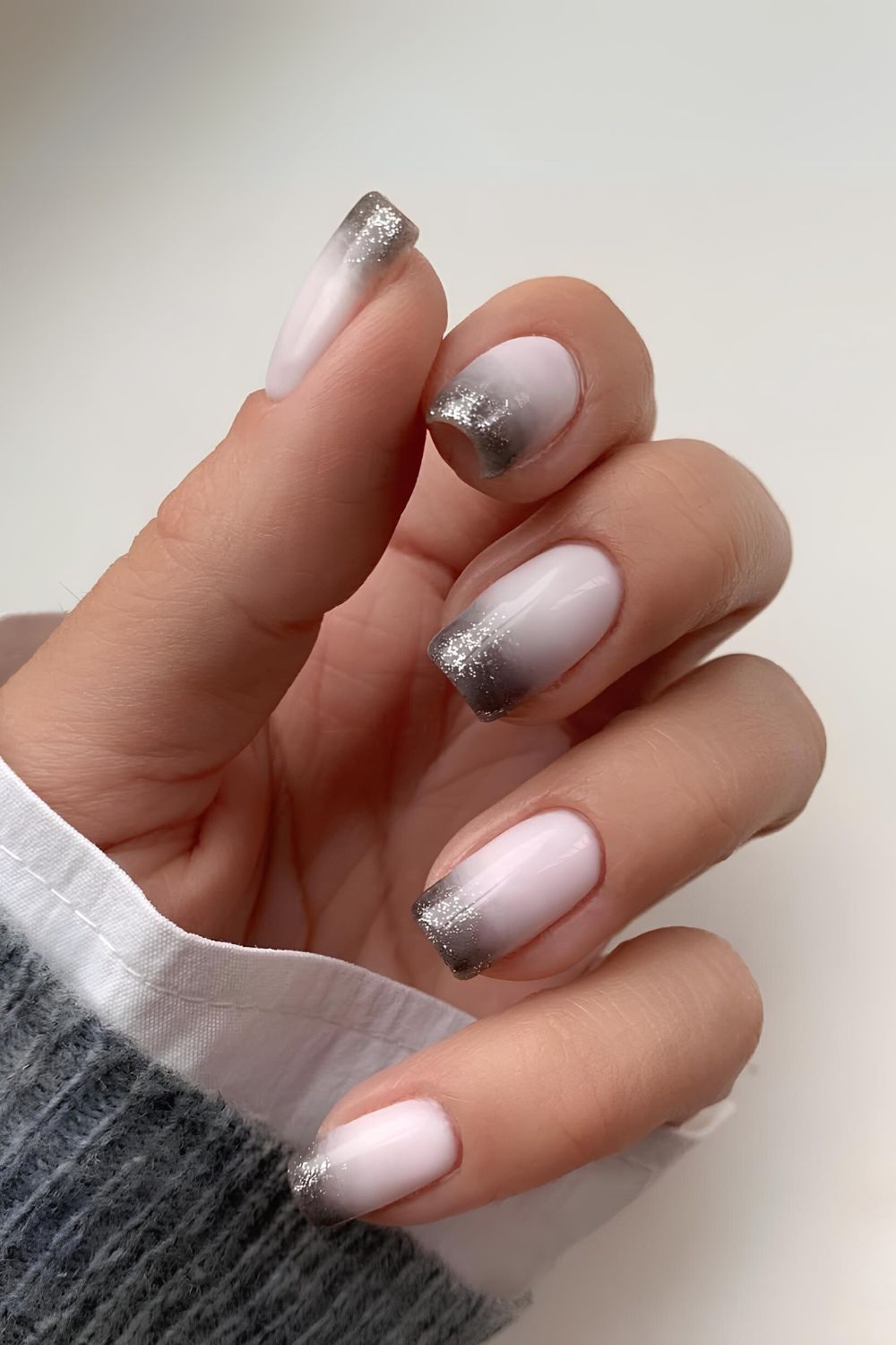 Milky white nails with silver ombre French tips