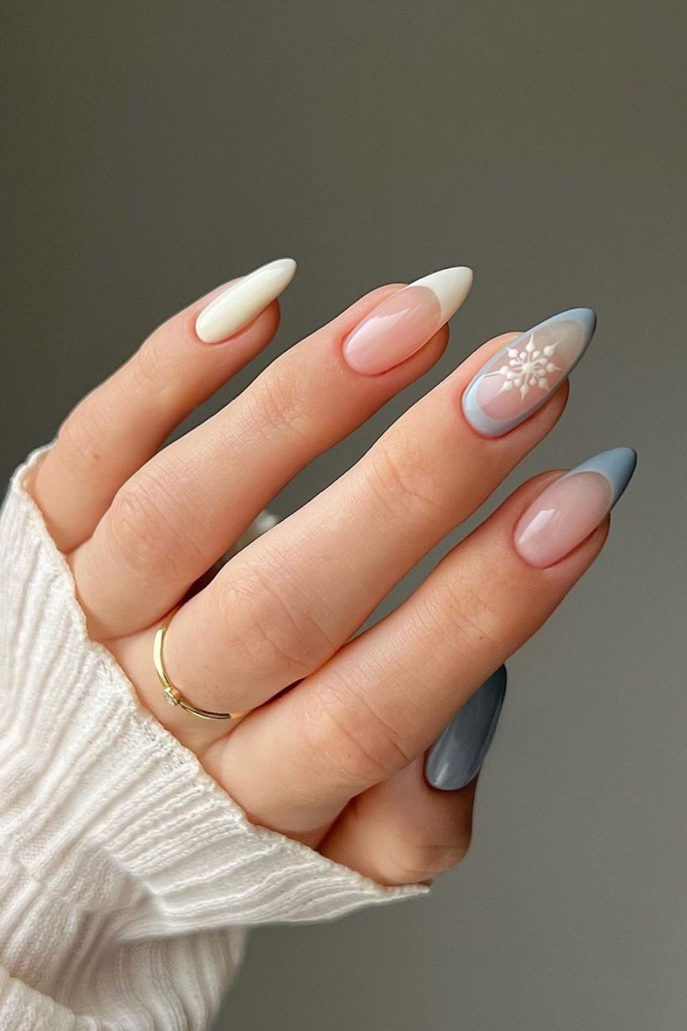 Minimalist design cool-tone white and blue nails with a single snowflake accent