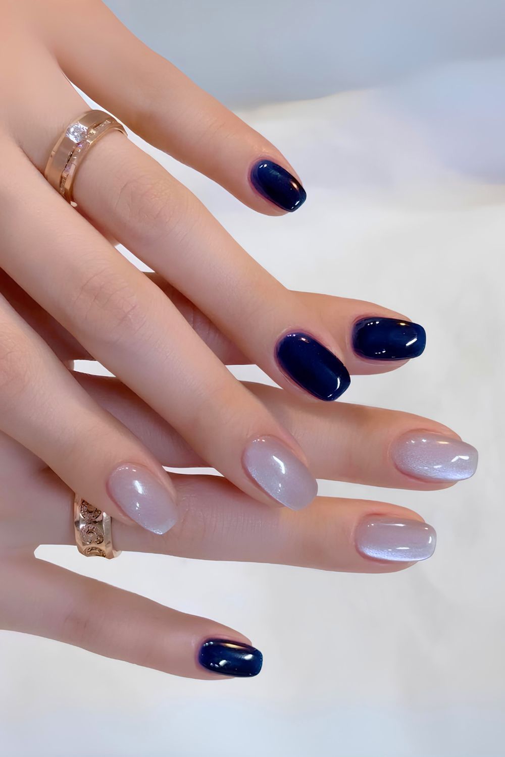 Navy blue nails with glass-effect accent nails