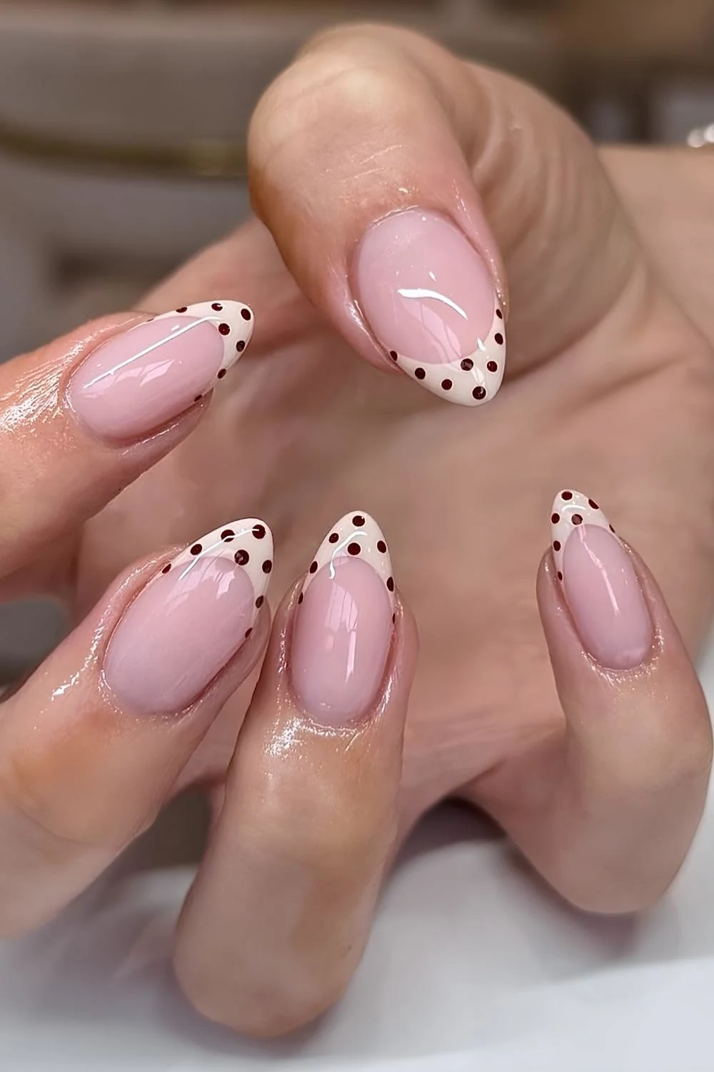 Neutral French mani with brown polka dots