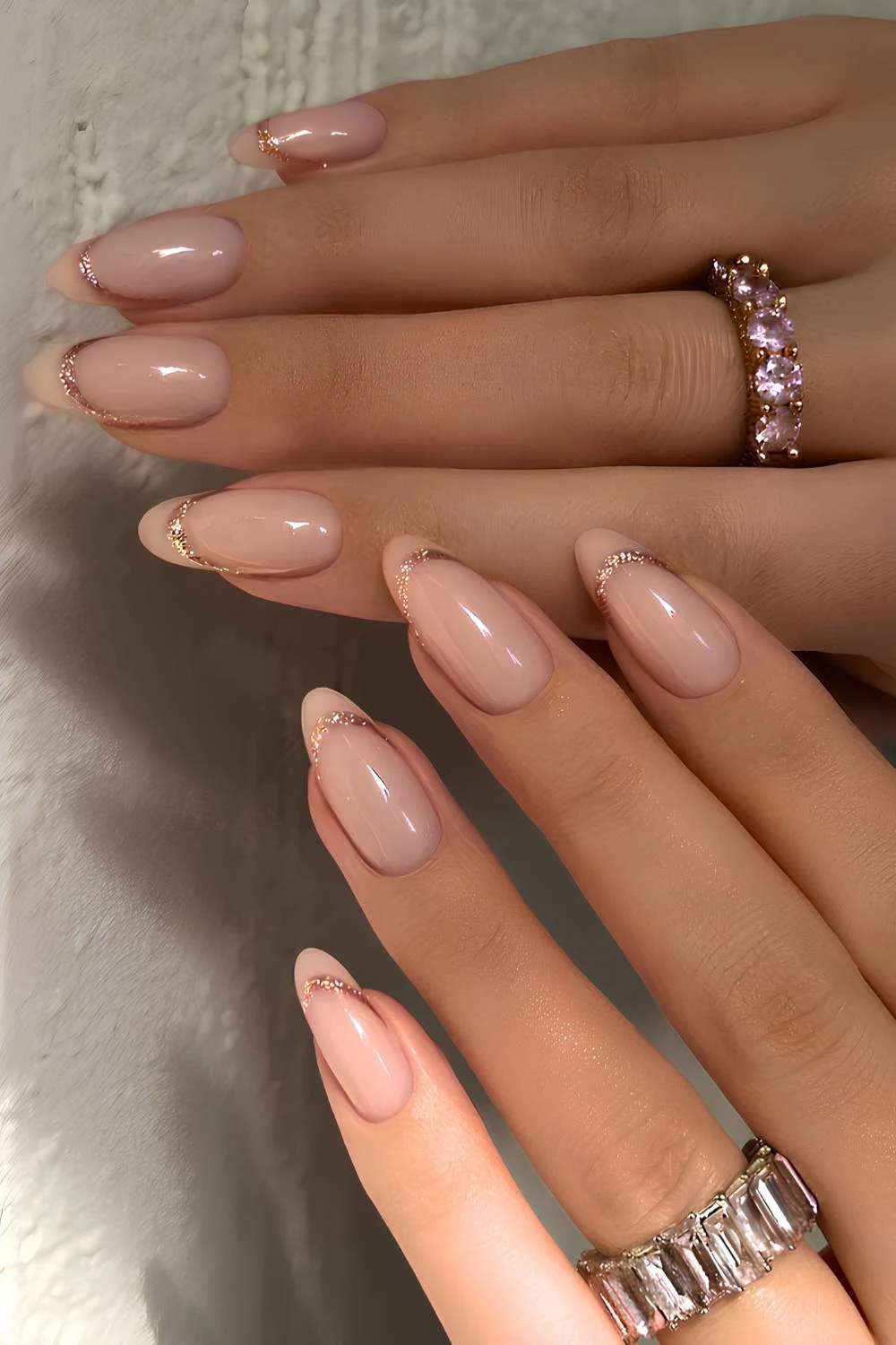 Neutral glitter-edged French tip nails